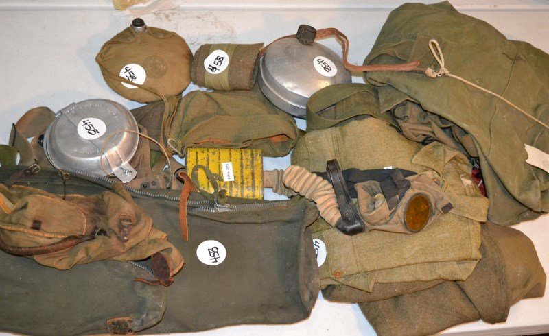 Grouping of WWI Era and Boy Scout Field Equipment: Military and Scout items including mess kit, canteens, gas masks, uniforms, rifle bag, etc.