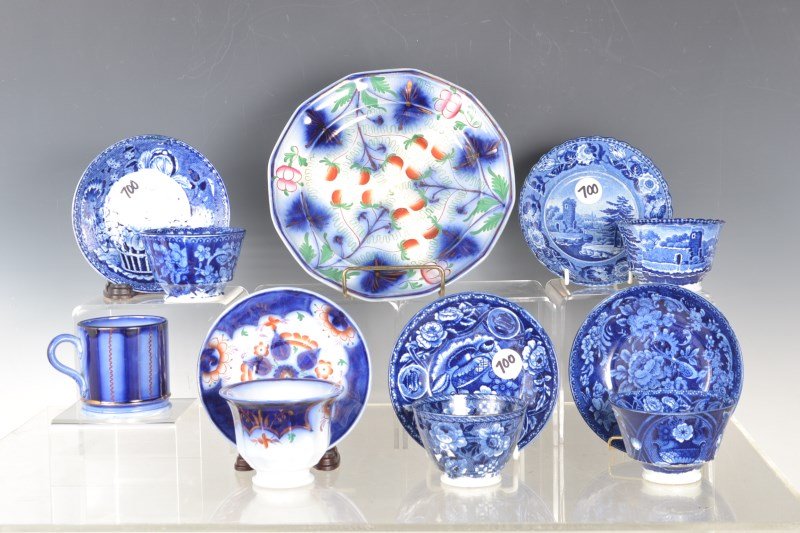 Grouping of Flow Blue / Blue Transfer: Flow blue and blue transfer cups and saucers (four pairs) along with Gaudy Ironstone 8.5" plate, Gaudy Ironstone cup and plate, as well as a mug