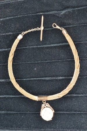 Victorian Hair Art Watch Chain: Victorian hair art watch chain. 15" woven hair chain with gold-filled findings and center locket.