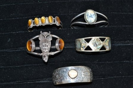 Southwestern Jewelry: Five Southwestern style cuff bracelets. With Abalone, tiger eye, and jasper, 3.74ozt.
