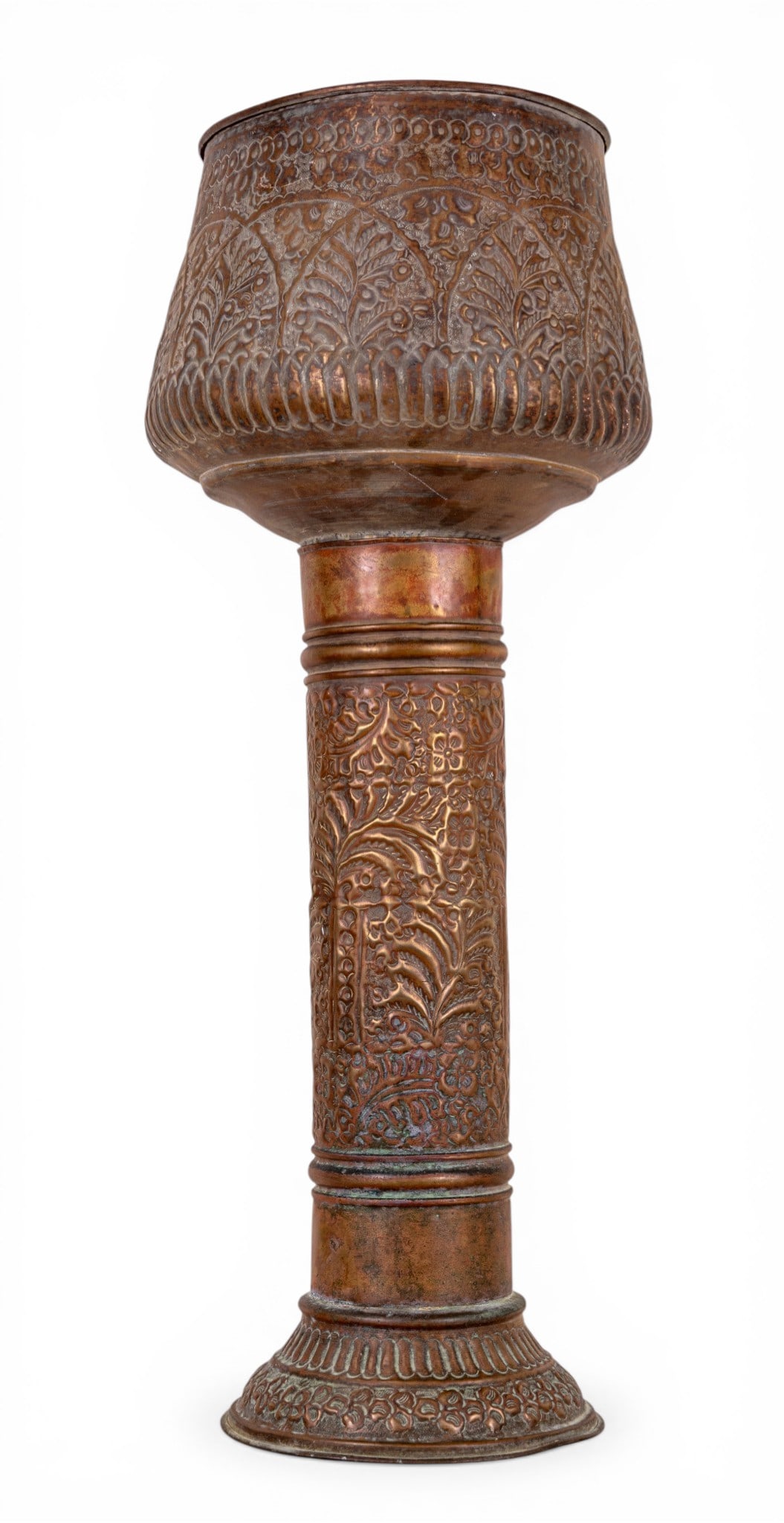 Early 20th C Tall Middle Eastern Copper Brazier: Early 20th Century Middle Eastern copper pedestal brazier with heavy decorative relief. Measures approx. 40.5" H x 15" Diameter. Condition: A dent is present on pedestal, and mouth of brazier is sligh