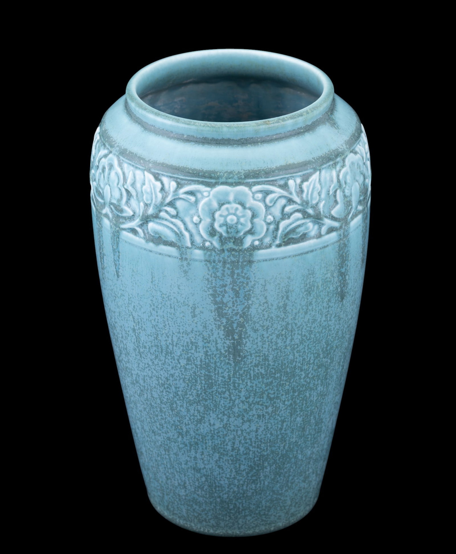 Rookwood Pottery Vase Style 2484: A Rookwood Pottery Vase in style #2484. Date Code XXVIII (1928). Tall cylindrical form with a flared rim, decorated in low relief with a continuous floral and foliate band near the top. Finished in a