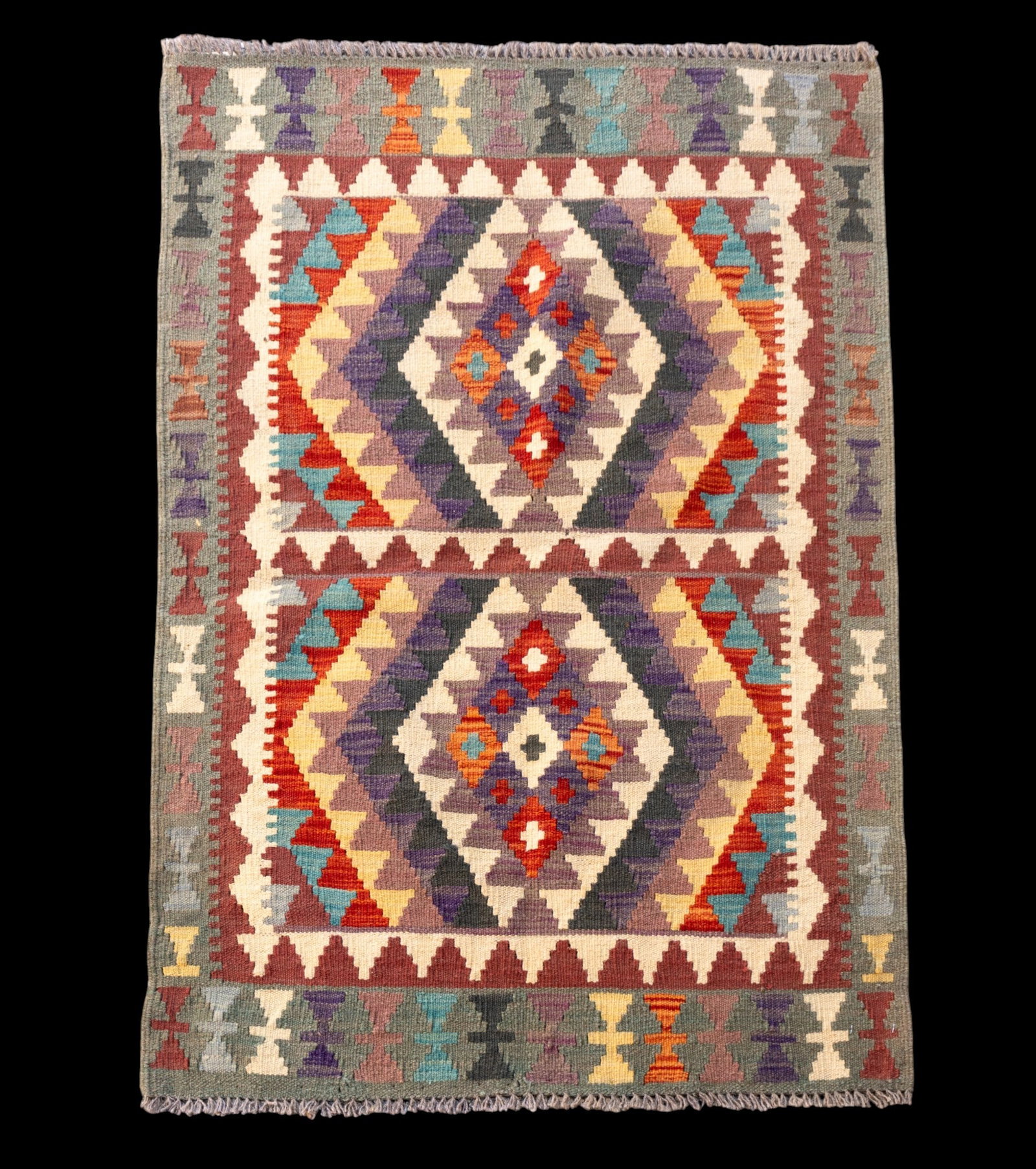 Handmade Geometric Design Rug: Handmade rug with a Caucasian design, measures approx. 2'10" x 4'2".