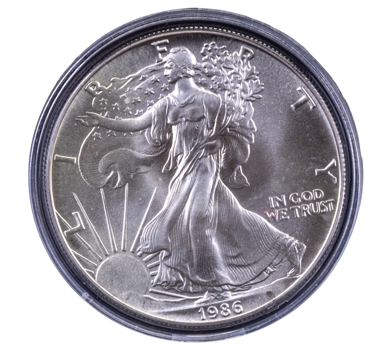 1986 American Silver Eagle Bullion Coin: 1986 American Silver Eagle bullion coin encapsulated in a clear protective case. Features a design of Lady Liberty striding on the obverse with inscriptions "LIBERTY," "IN GOD WE TRUST," and the year