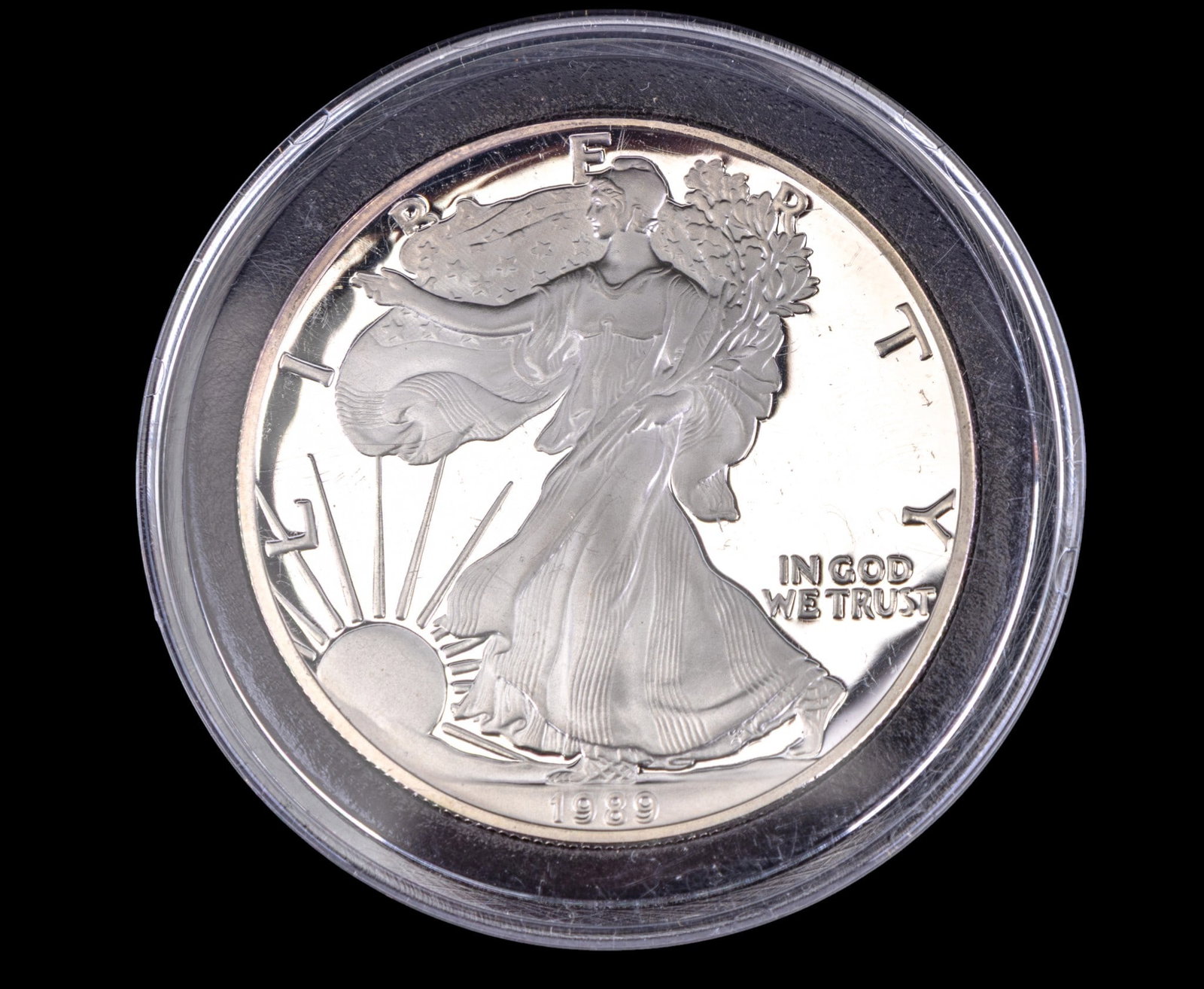 1986 American Silver Eagle Bullion Coin: 1986 American Silver Eagle bullion coin, struck in .999 fine silver with a weight of 1 troy ounce. Obverse features Adolph A. Weinman's iconic Walking Liberty design, and reverse displays the heraldic