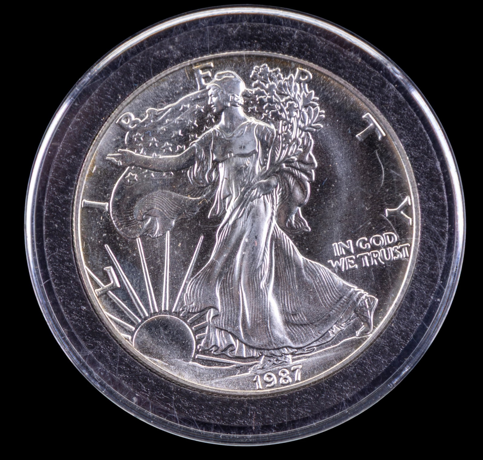 2021 American Silver Eagle 1 oz Coin: 2021 American Silver Eagle 1 oz bullion coin in a protective plastic case. Obverse side features Walking Liberty design by Adolph A. Weinman, while the reverse side shows the heraldic eagle with shiel