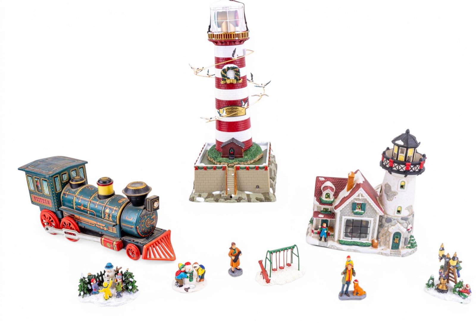 Lighthouse Christmas Train Scenery and Tin Toy: A vintage Modern Toys battery operated tin train locomotive toy, a collection of miniature figurines, and Christmas themed light house scenery,