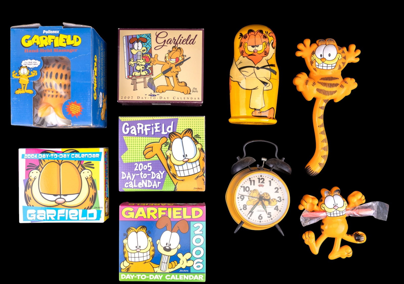 Vintage Garfield Collectibles Lot: Group of vintage Garfield character collectibles featuring licensed merchandise after Jim Davis. Includes a Sunbeam twin bell alarm clock (model no. 883-140) with Garfield dial, a PolleneX Garfield ha