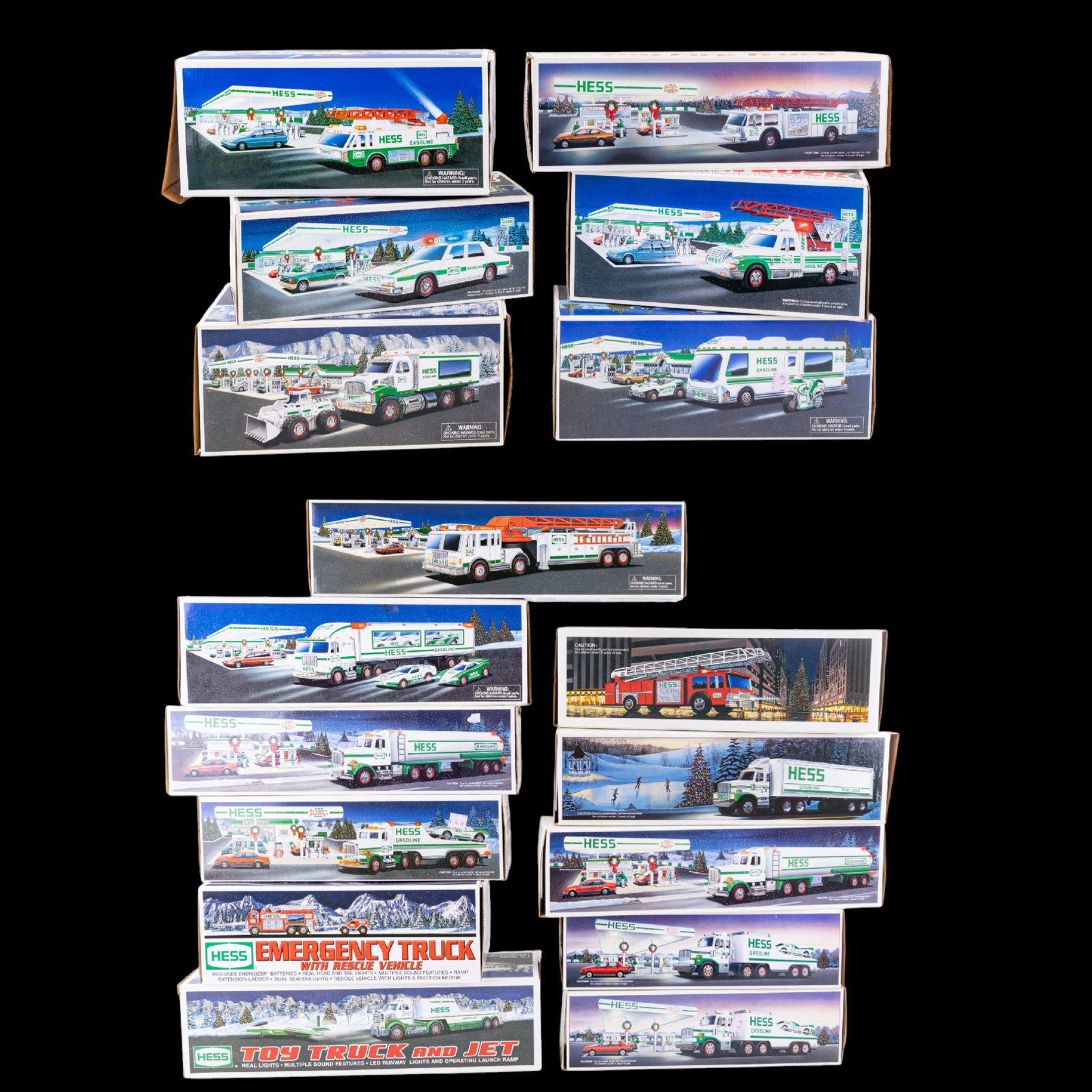 17 Hess Toy Trucks w/ Boxes: Collection of 17 Hess toy trucks and vehicles, each retaining original packaging. Lot includes a variety of classic Hess releases featuring tanker trucks, fire trucks, and specialty vehicles. Contents