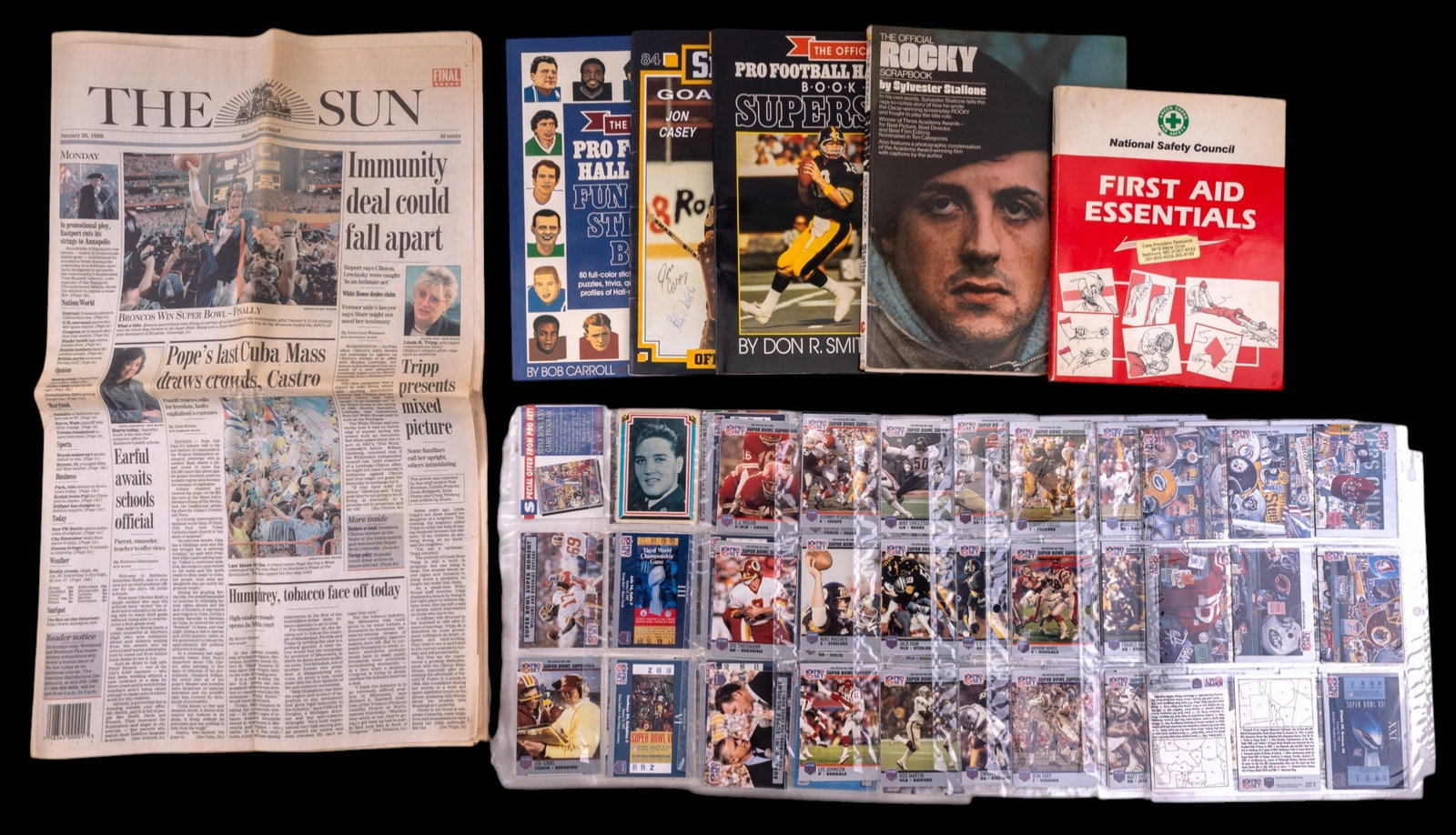 NFL Pro Set Trading Cards, Sports Books, & More: A collection of approx. 160 NFL Pro Set Super Bowl Heroes trading cards, the Rocky Balboa Scrapbook, NFL HoF books, and more.