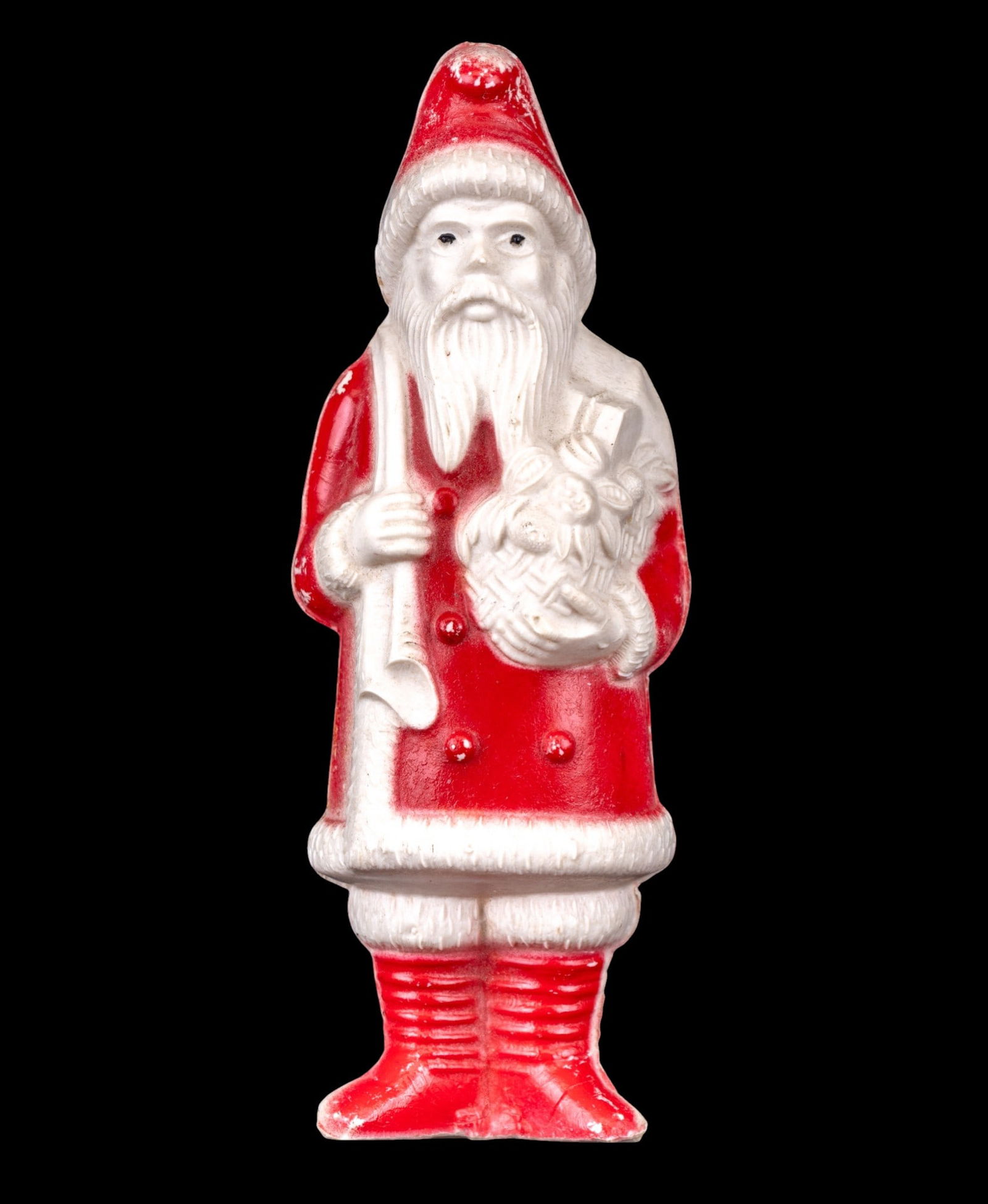 Vintage Irwin Celluloid Santa Claus Figure: Vintage Irwin Santa Claus figure crafted from celluloid and manufactured in the USA during the 1930s or 1940s. Features a red and white painted finish with molded details, including Santa holding a sa