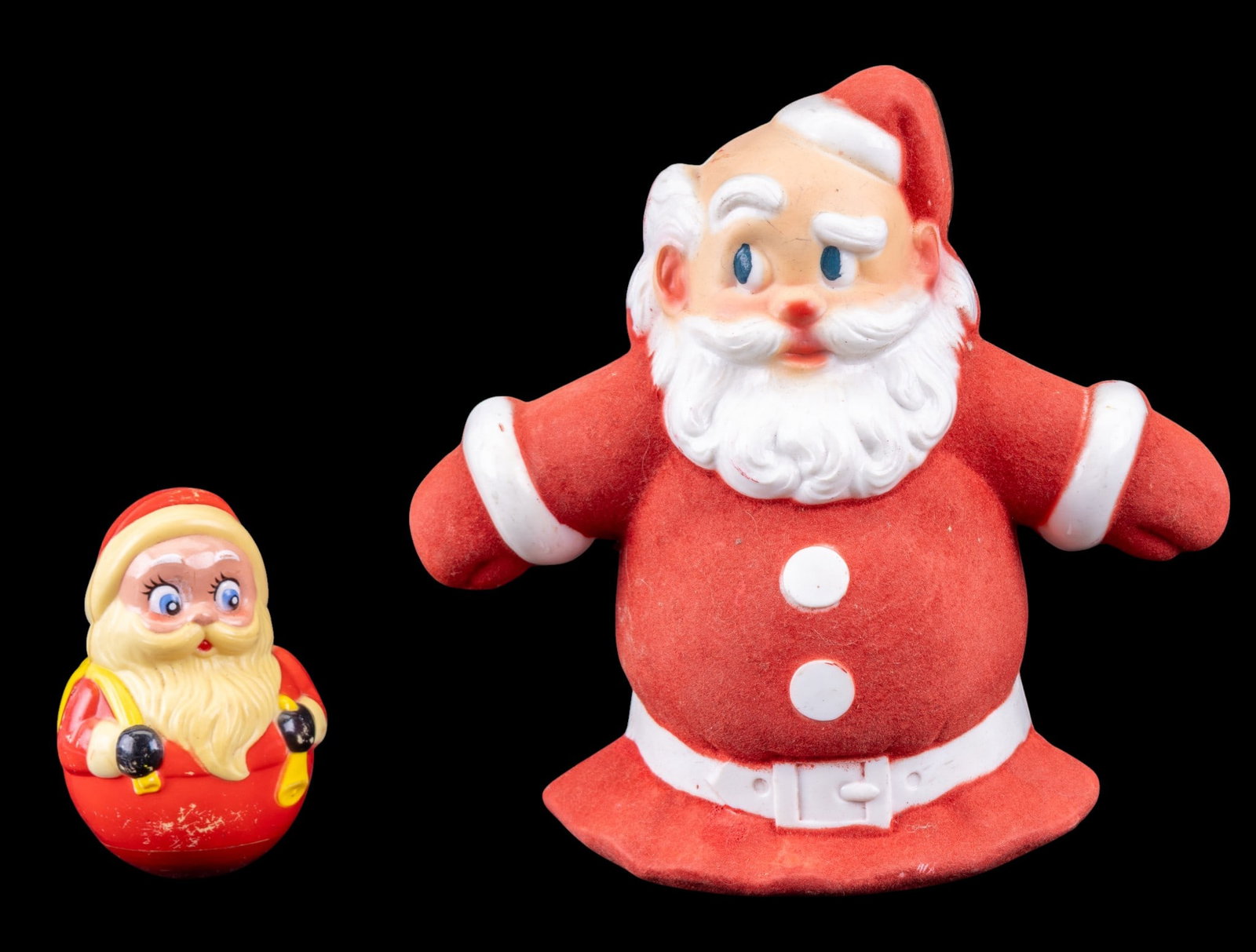 Vintage Glo-Lite Santa Topper & Santa Weeble: A vintage illuminated Santa Claus tree topper by Glo-Lite, featuring a wired plug for illumination, and a Santa-themed weeble wobble toy by Kiddie Productions.