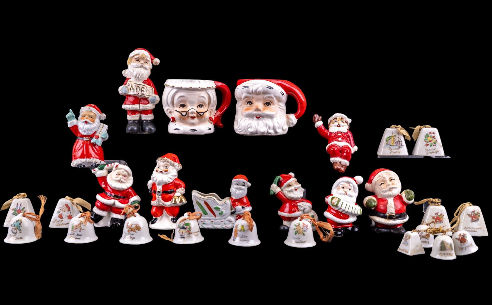 Vintage Christmas Ceramics: Assorted lot of mid-20th century Christmas ceramics/porcelain including a pair of Santa and Mrs. Claus figural mugs and a group of Santa Claus figural salt and pepper shakers, and 2 sets of porcelain