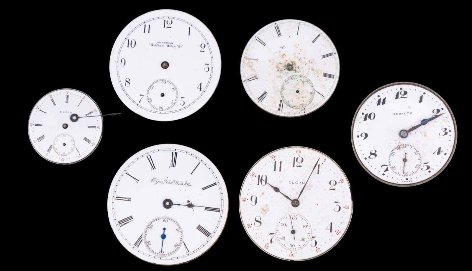 Muralto, Elgin, Waltham Pocket Watch Movements: A collection of four Elgin pocket watch movements, a Waltham, and a Muralto movements. Dial diam ranges from 1.125" to 1.75". Names and style/edition numbers as seen in photos.