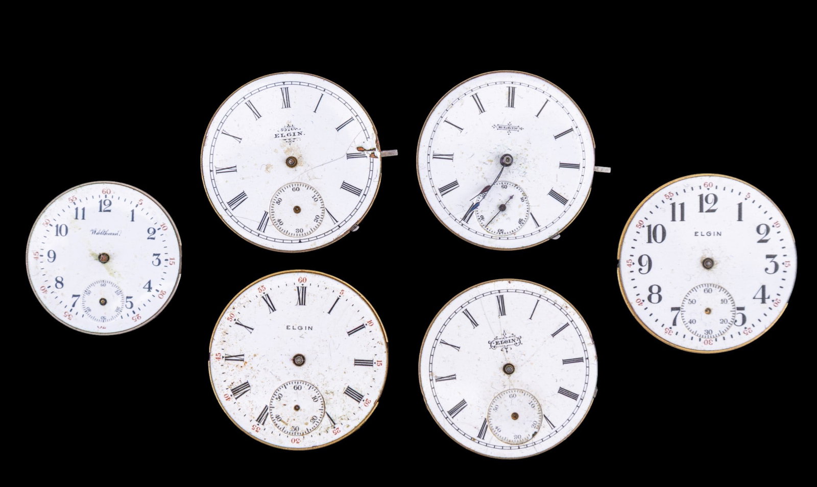 Elgin and Waltham Pocket Watch Movements: Five Elgin pocket watch movements and one Waltham movements, featuring porcelain dials. Dial diam range from 1.125" to 1.625". Names and style/edition numbers as seen in photos.