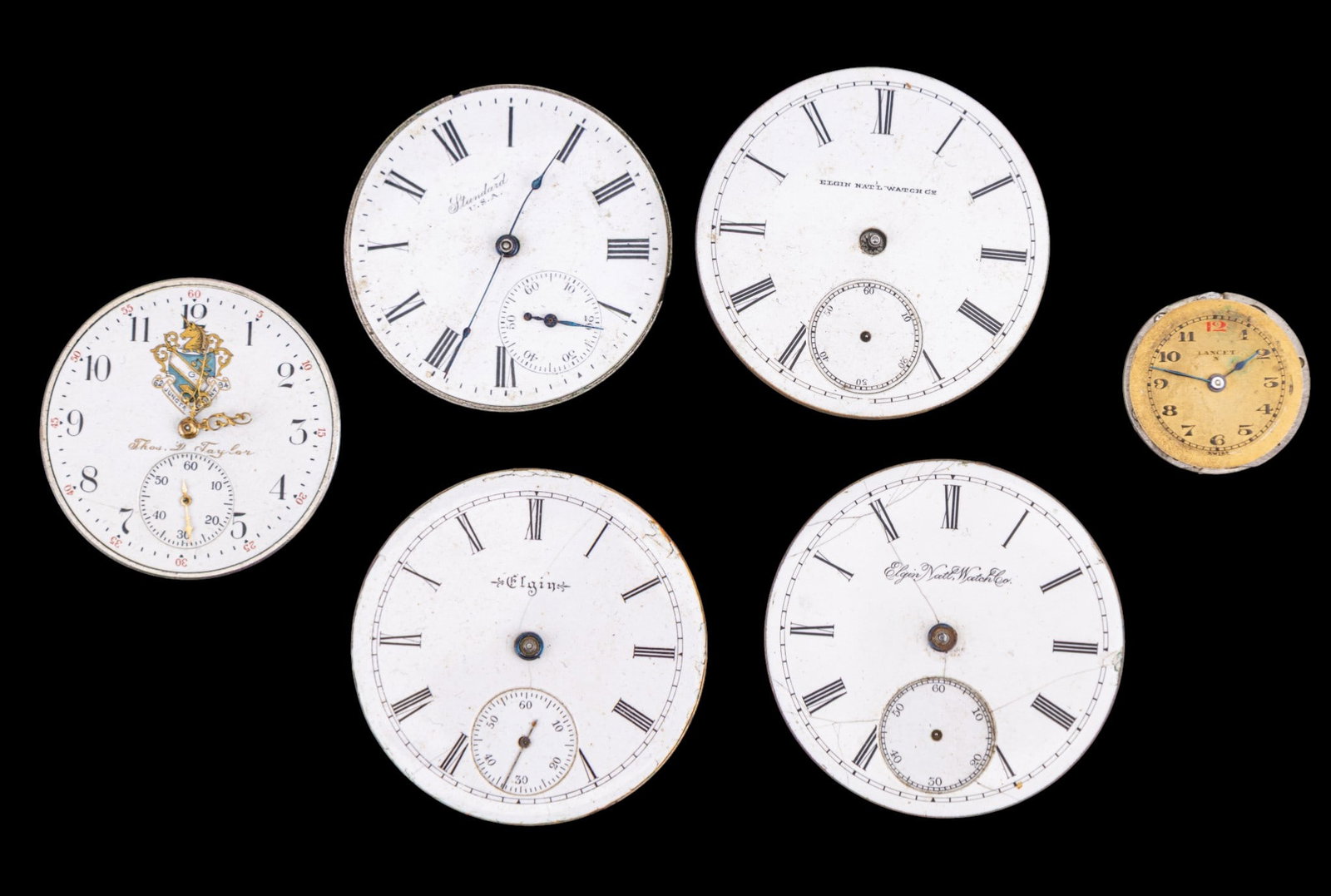 NY Standard, Elgin, & Other Pocket Watch Movements: Pocket Watch movements including four Elgin movements, one features a porcelain dial signed 'Thomas D. Taylor', A. Beniot-Nicolet Lancet, and New York Standard, featuring porcelain and metal dials. Di