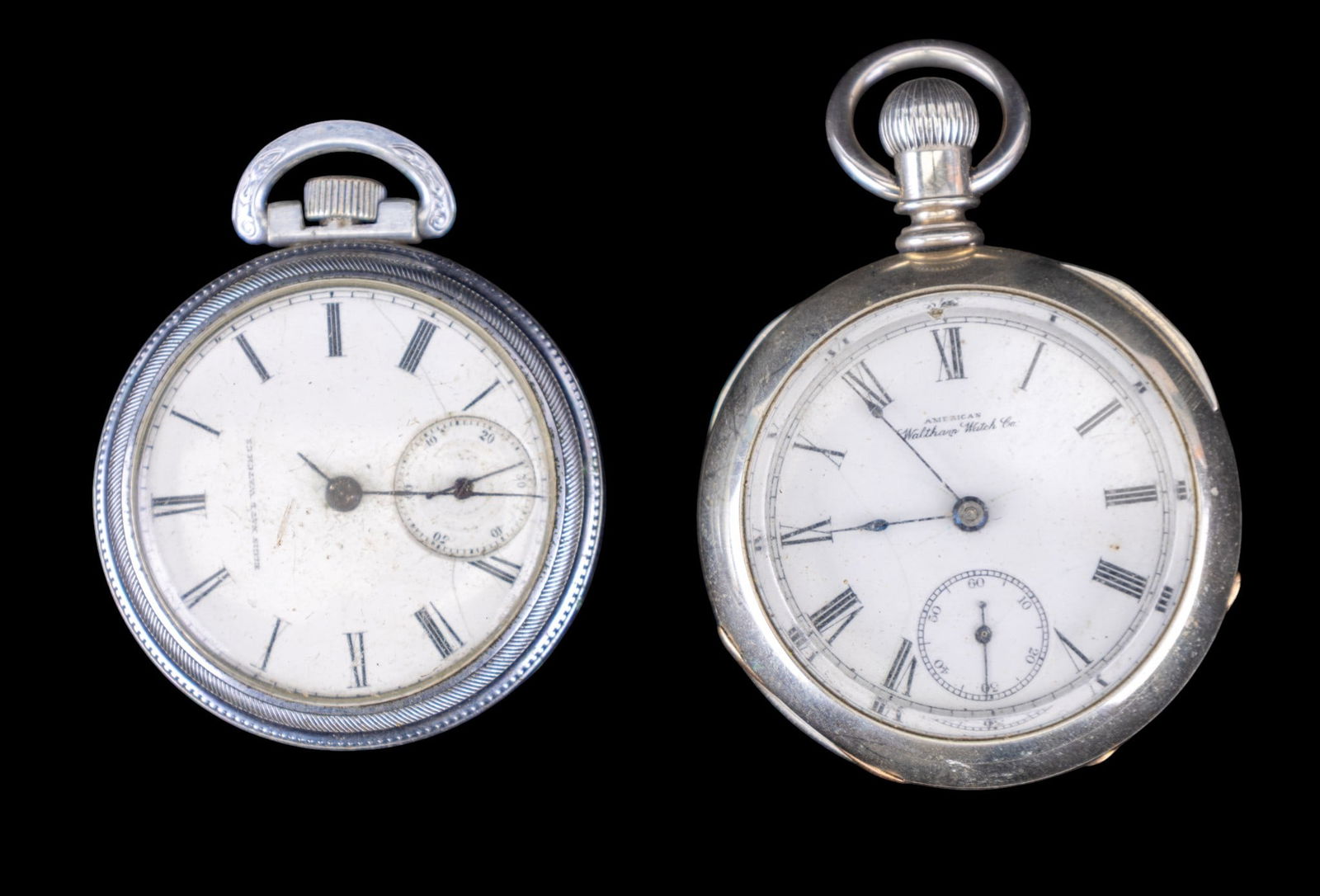 Elgin and Waltham Pocket Watches: A Waltham pocket watch silveroid huntsman case and an Elgin pocket watch in an etched base metal twist off case, both have 1.75" diam porcelain dials. Names and style/edition numbers as seen in photos