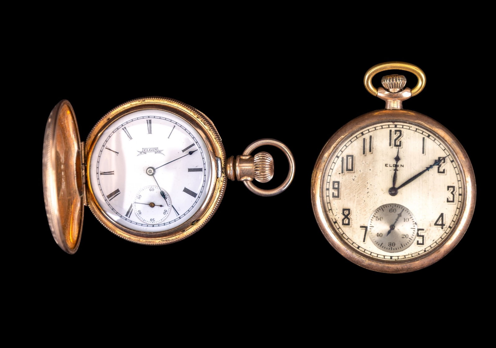 Elgin Pocket Watches: An Elgin pocket watch in a Fahys Montauk 20 year gold plated twist off case with etched floral deign and 1.5" metal dial , and an Elgin pocket watch in an Excelsior gold tone huntsman case with finely