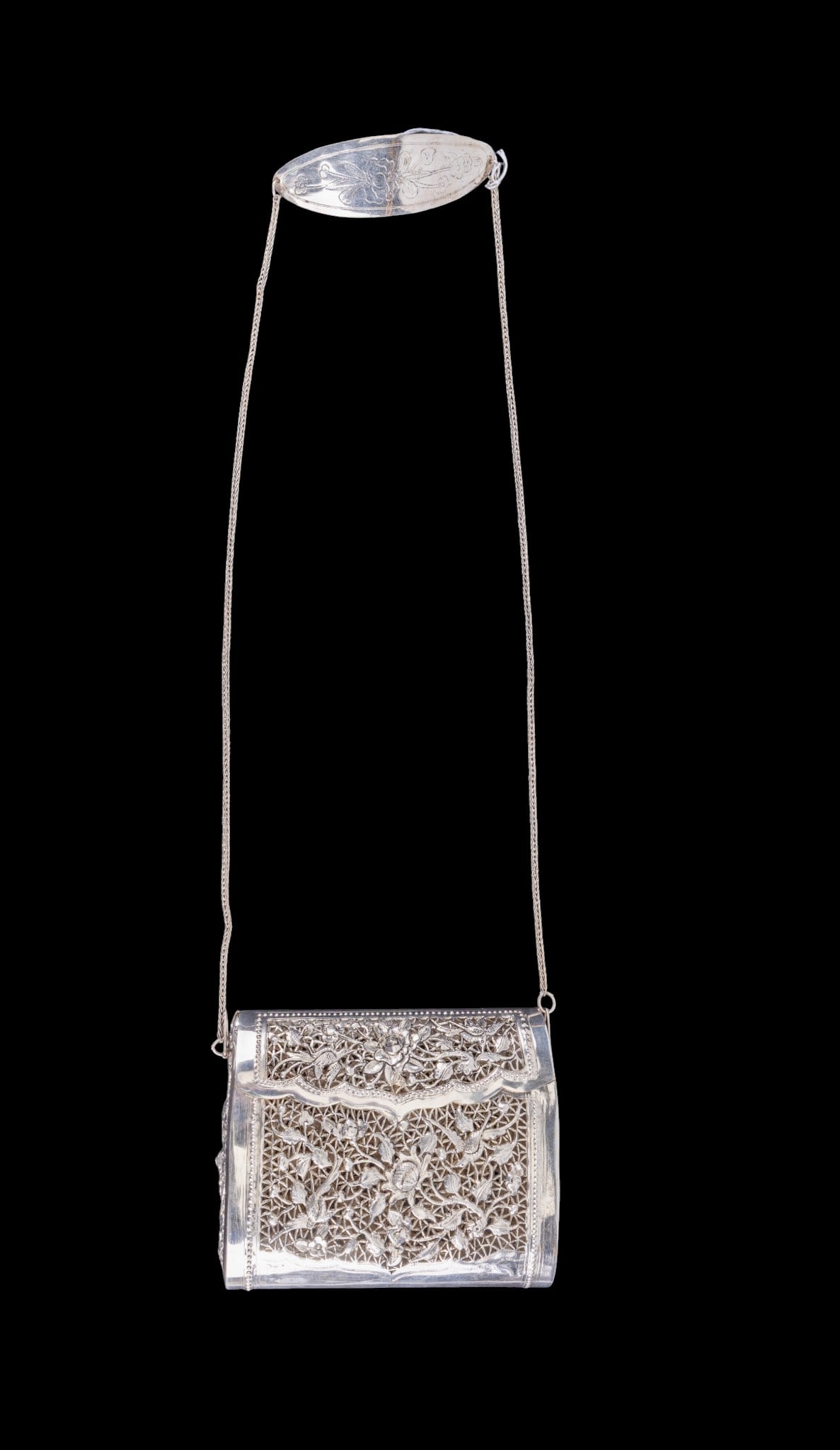 Chinese Silver Filigree Purse w/ Chain: Chinese silver purse of rectangular form, featuring openwork panels with detailed bird and foliate motifs throughout, hinged lid with scalloped edge and integeral clasp. Weighs approx. 290 grams.