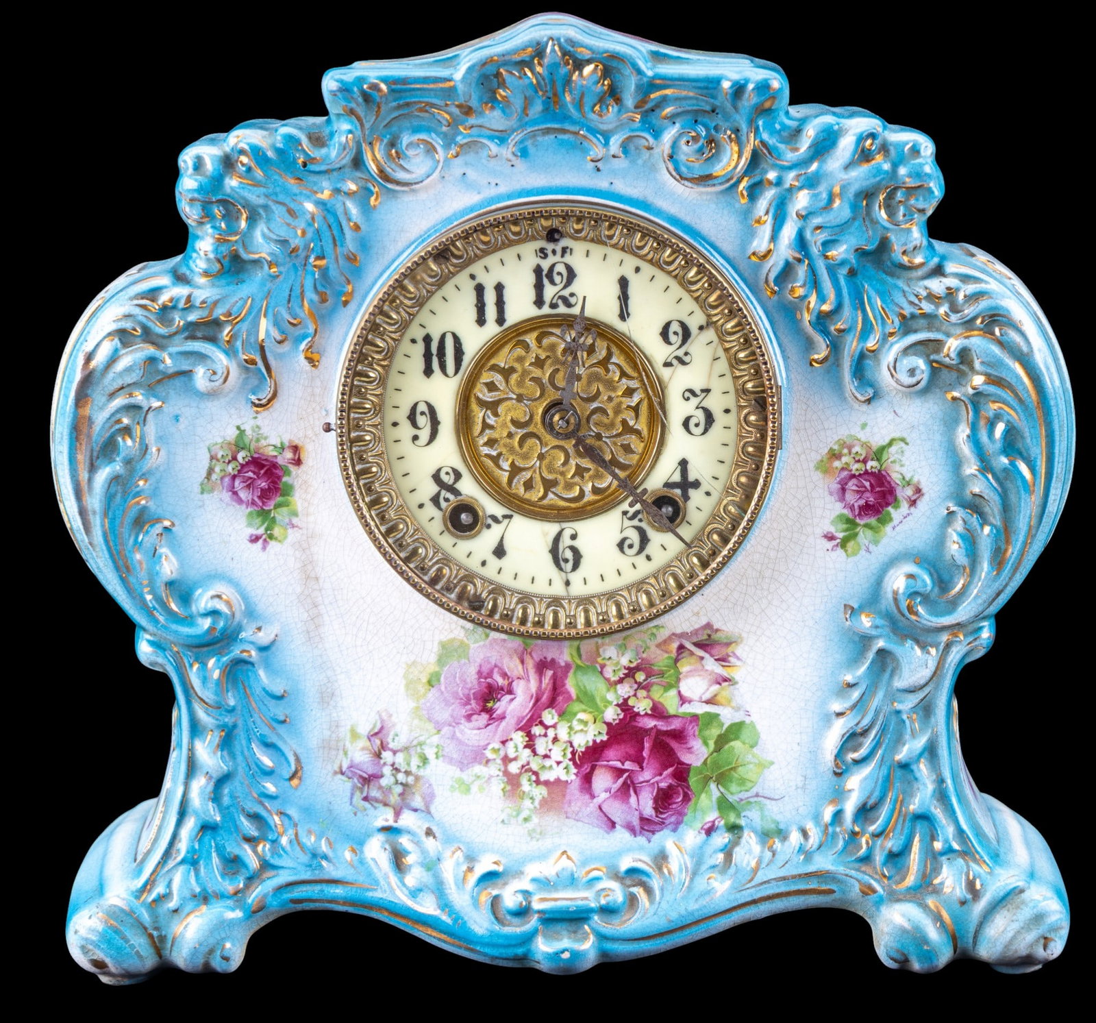 Wm. L. Gilbert Clock Co. Porcelain Mantel Clock: Antique American porcelain mantel clock by the Wm. L. Gilbert Clock Company, Winsted, Connecticut. Clock features a molded porcelain case in sky blue with gilt scroll decoration and painted floral