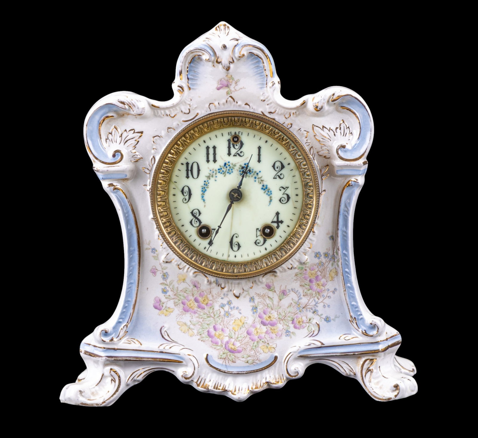 20C Melba Porclain Mantel Clock, Gilbert Clock Co.: 20th century porcelain mantel clock housed in a molded Melba porcelain case, featuring scrolling Rococo-style form with pale blue accents, gilt highlights, and painted floral decoration to the front a