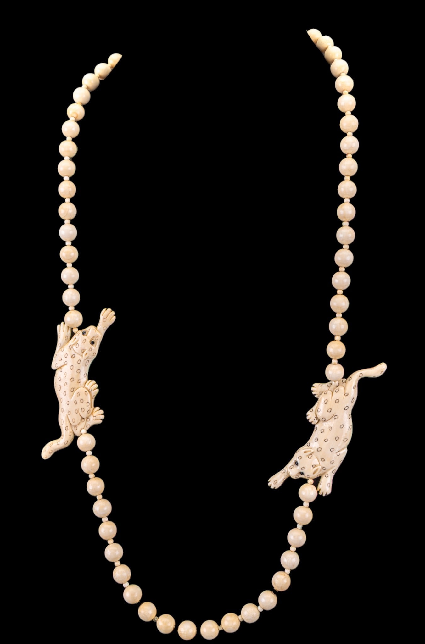 Carved Natural Material Jaguar Necklace: A natural material beaded necklace featuring carved jaguar station charms, measures approx. 16" on the drop. MUST BE SOLD IN PA ONLY- Item can only be sold to Pennsylvania residents inside the state o