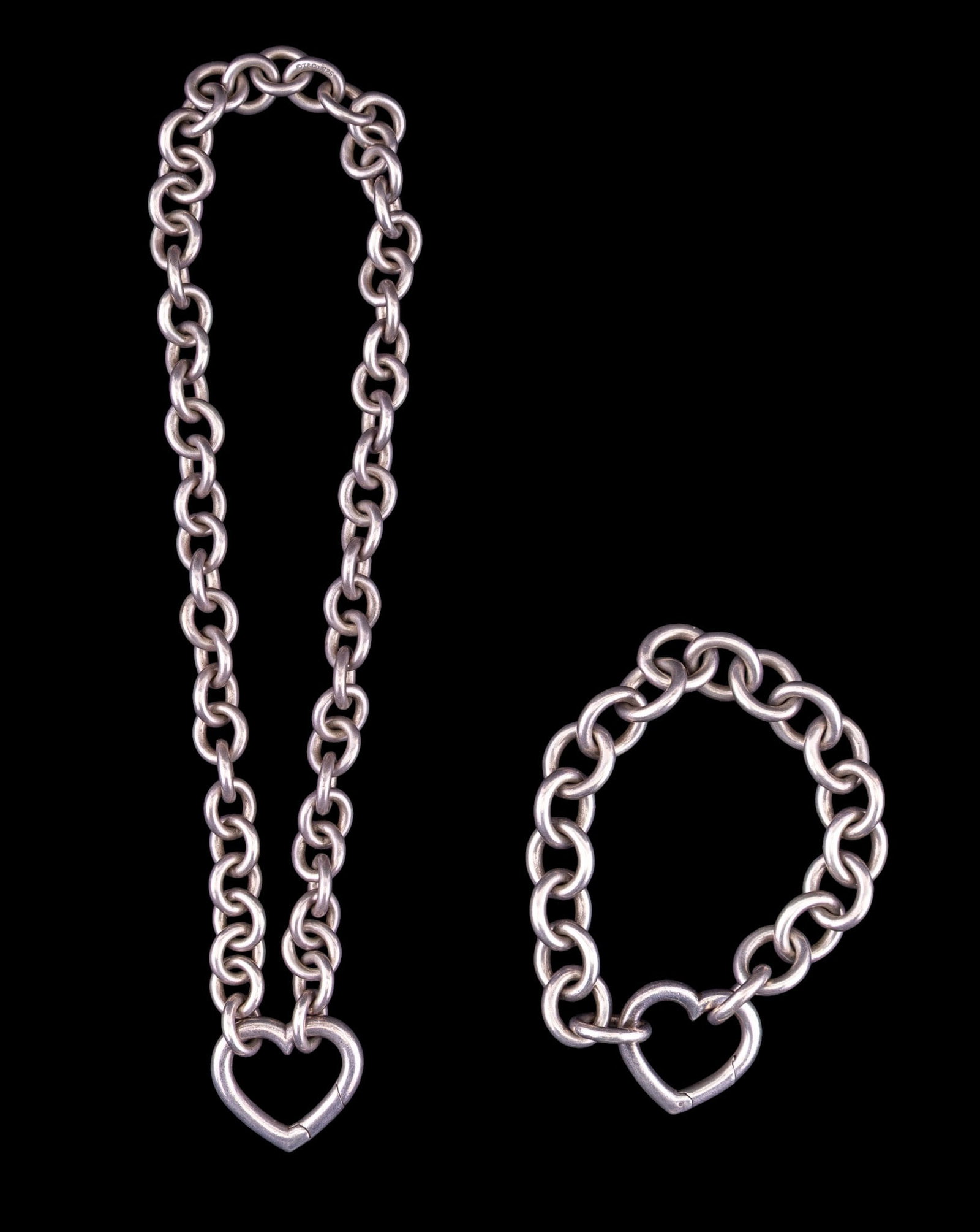 Tiffany & Co Heart Clasp Link Bracelet & Necklace: Tiffany & Co. heart clasp link bracelet and necklace set, necklace measures approx. 6" on the drop, total weight is approx.112g.