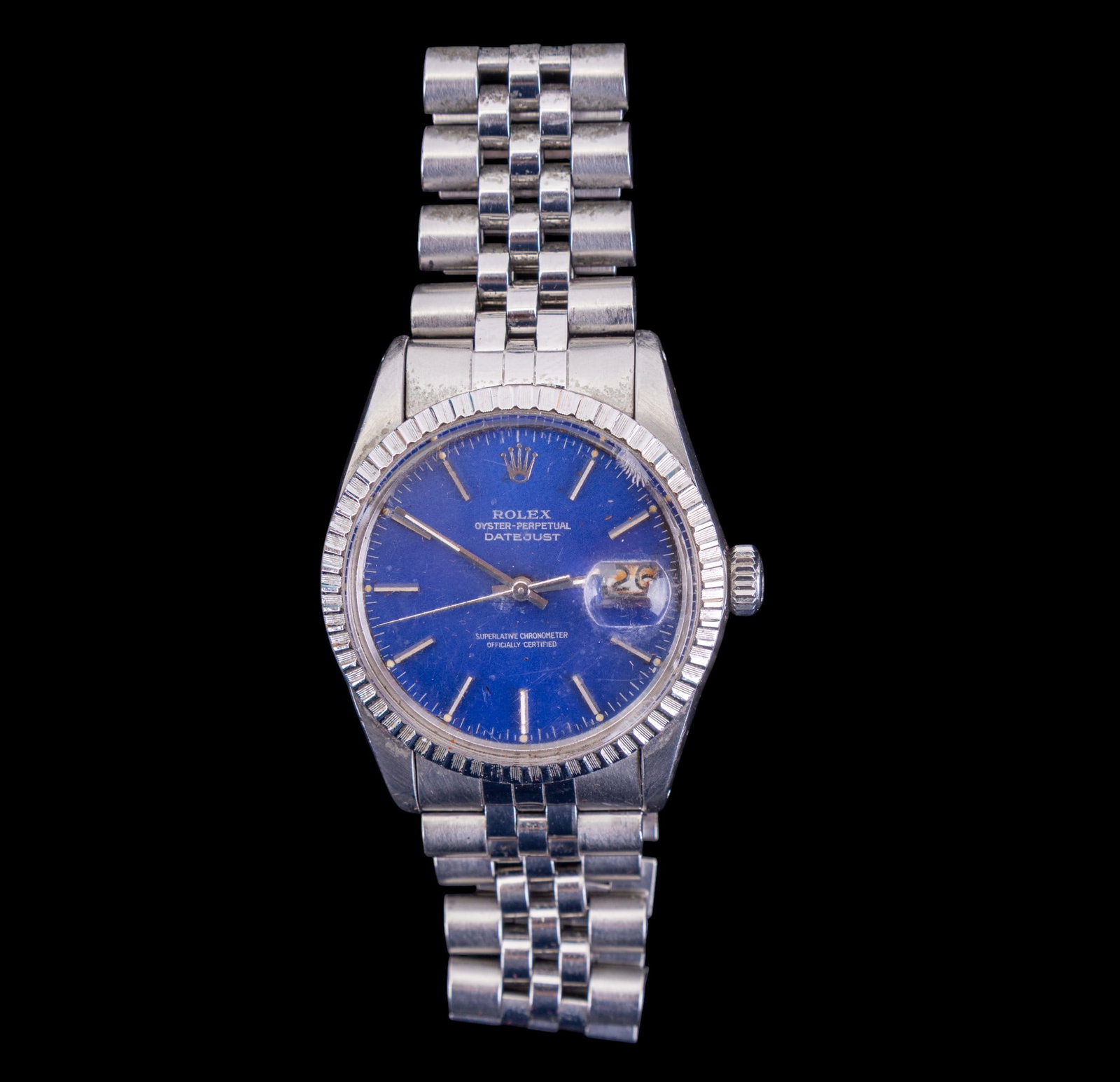 Rolex Men's Oyster Perpetual Wrist Watch: A Rolex 27 jewel Oyster Perpetual Datejust men's wrist watch featuring Steelinox closure and blue enamel dial. 555 end link. (in process of authentication.)