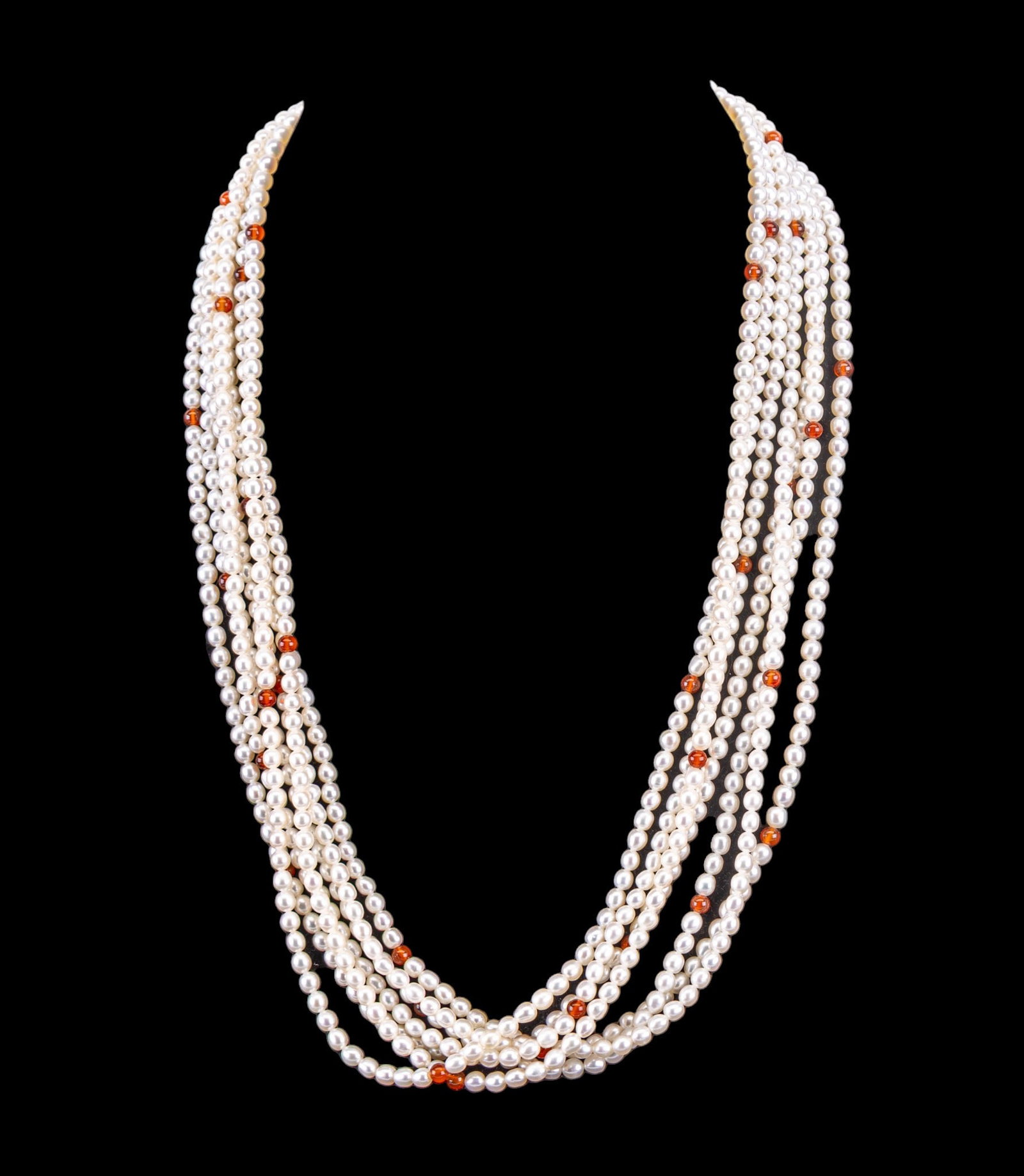 Carnelian and Pearl Vintage Necklace: Multi-strand white pearl necklace with accent carnelian beads, and a large silver clasp set with carved carnelian and pearl detail.