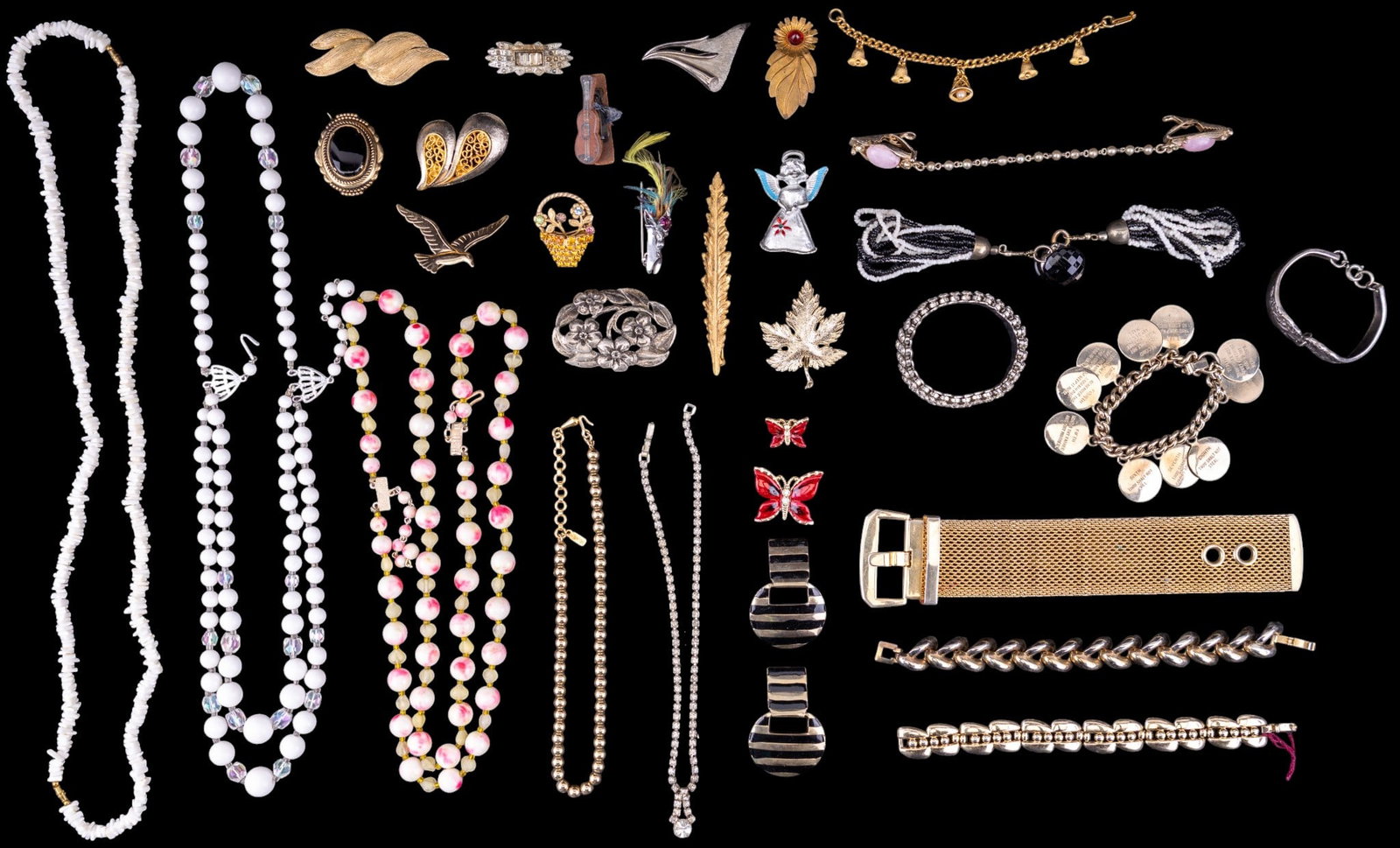 Vintage Costume Jewelry: Includes gold and silvertone necklaces, pink mod necklace, shell and others, many brooches, and more.