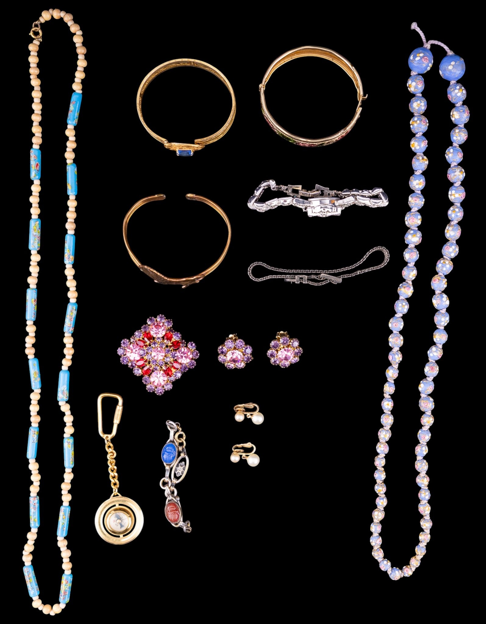 Vintage Jewelry: Includes a purple and pink rhinestone pin, Trifari pearl clips, art glass floral necklace, bracelets and more.