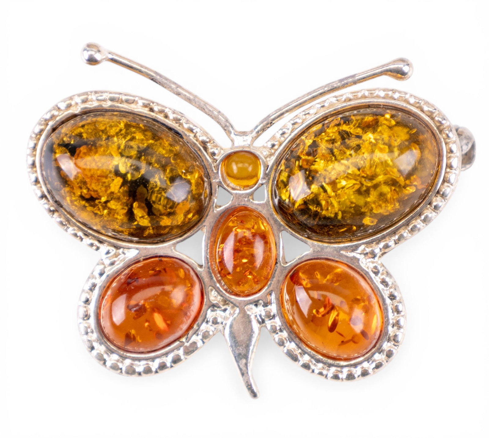 Amber Butterfly Brooch: .925 Sterling silver and amber brooch, fashioned of a butterfly.