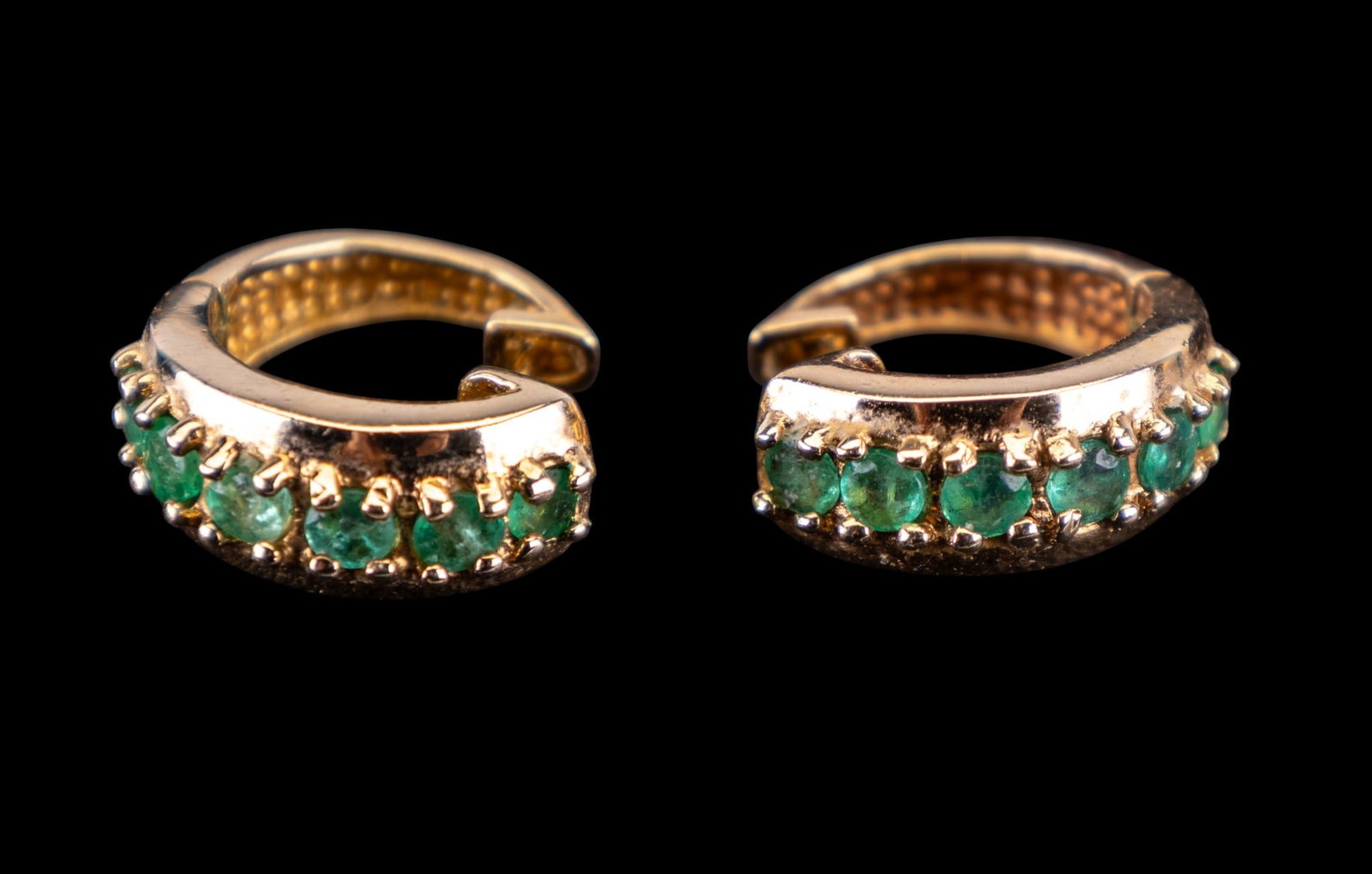 Emerald Hoop Earrings: Sterling silver vermeil, huggie hoop earrings, set with emerald beryls.