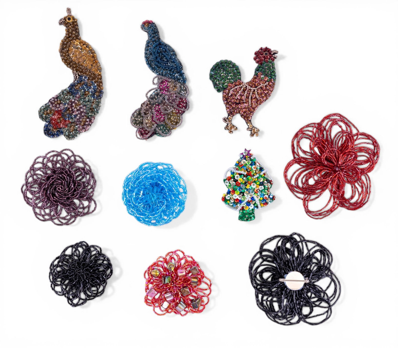 Sequin Peacock and Other Brooches: Includes four hand-made vintage sequin embroidered brooches; a rooster, (2 peacocks) and a christmas tree, the lot also includes several large beaded flower brooches.