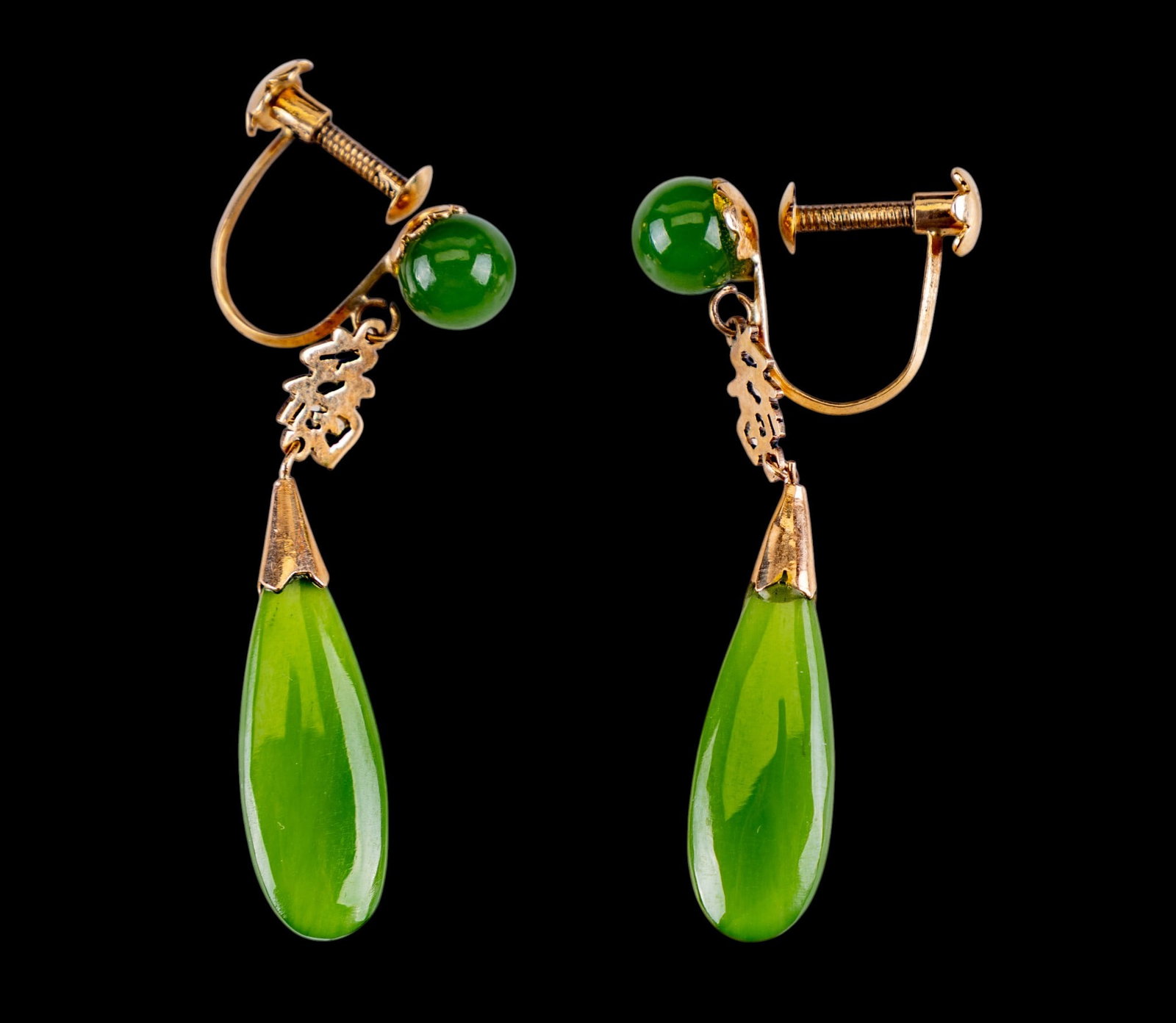 14K Gold Jade Screw Back Fu Earrings: A pair of 14K screw back earrings featuring a Fu mark above the teardrop shaped jade dangle.