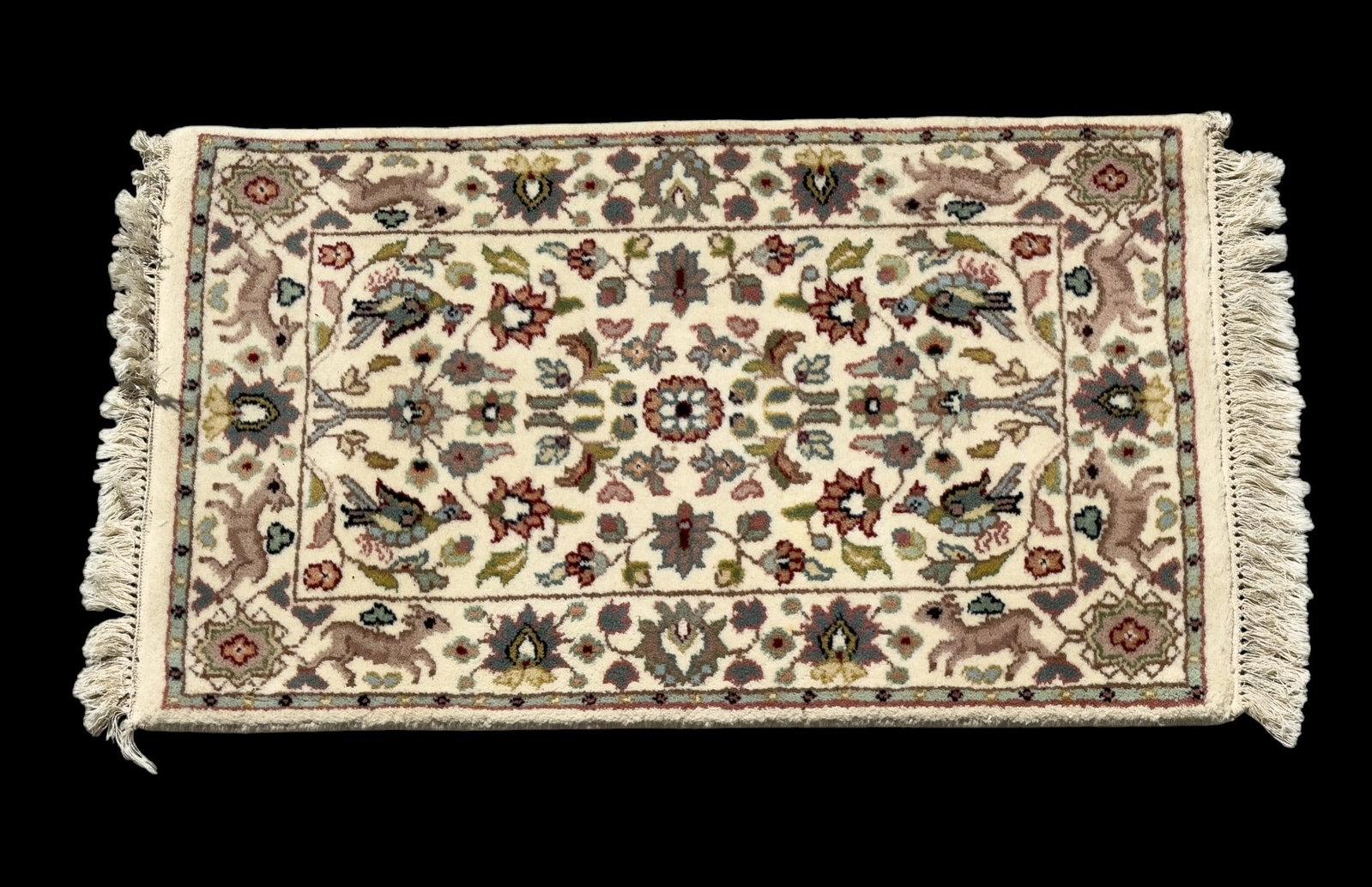 Persian Wool Ivory Rug: Persian wool rug in ivory tones with motifs of deer and birds. Measures approx. 2' x 3'1".