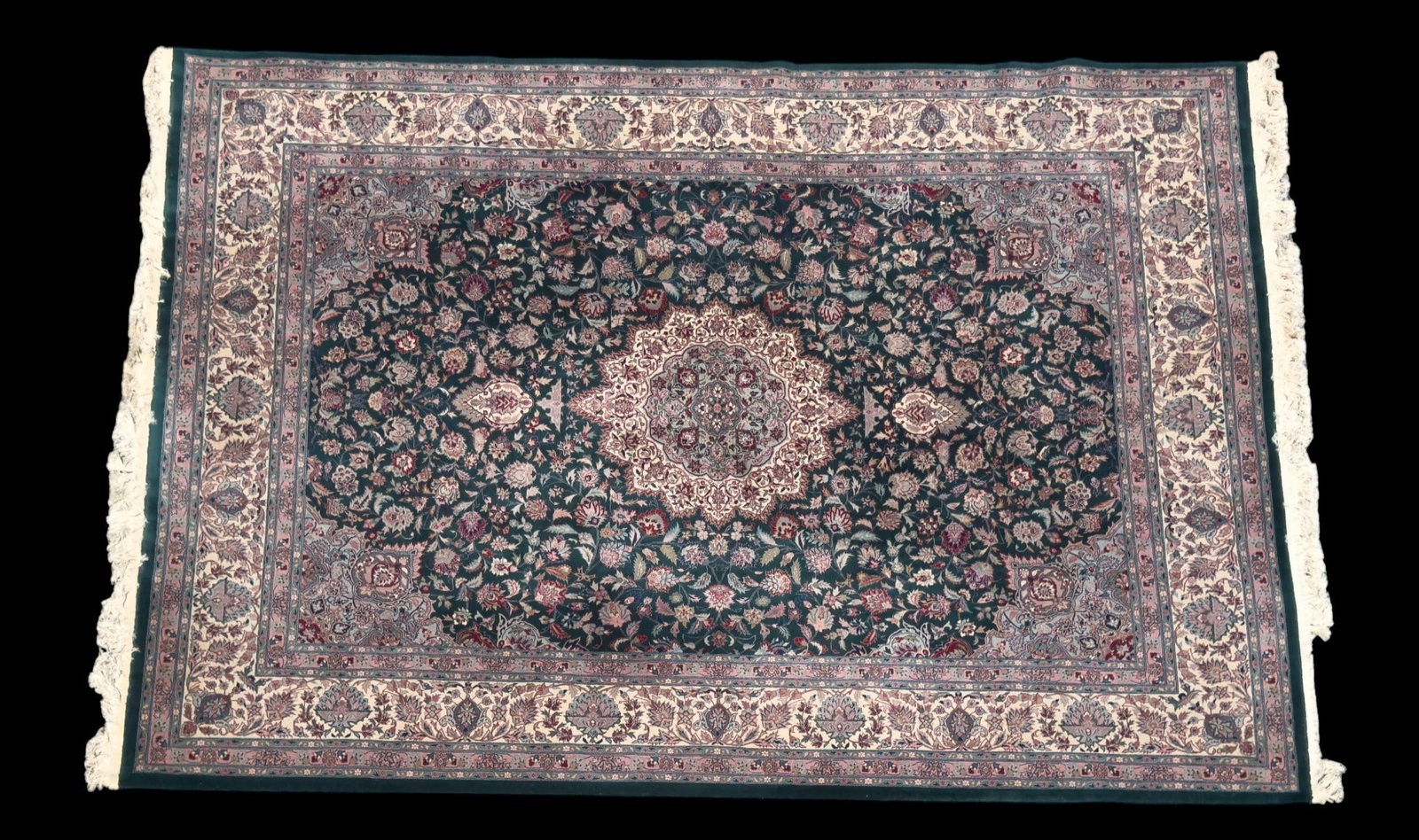 Finely Woven Tabriz Area Rug: Finely woven Persian Tabriz area rug with a green field. Measures approx. 9'2" x 12'4".