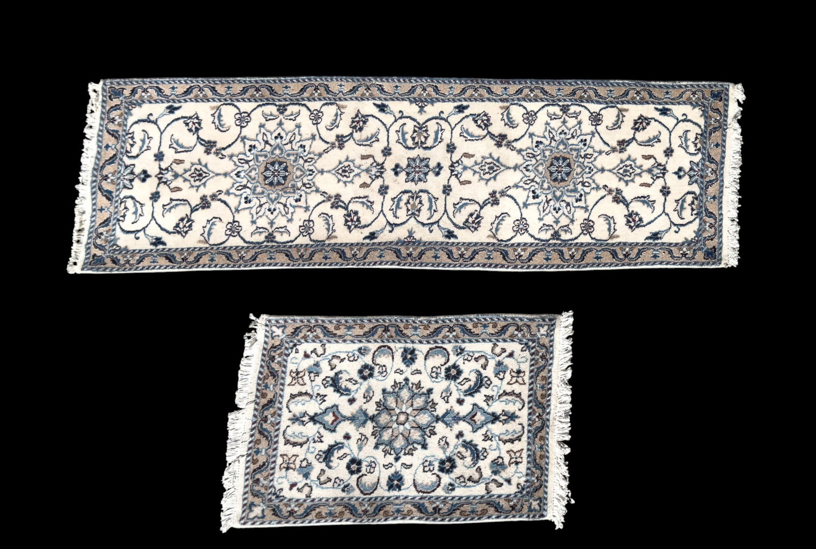 Persian Nain Rugs (2): Two Persian Nain rugs featuring an ivory field with blue flower motifs. Larger rug measures approx. 2' x 6'3" while the smaller measures approx. 2' x 3".
