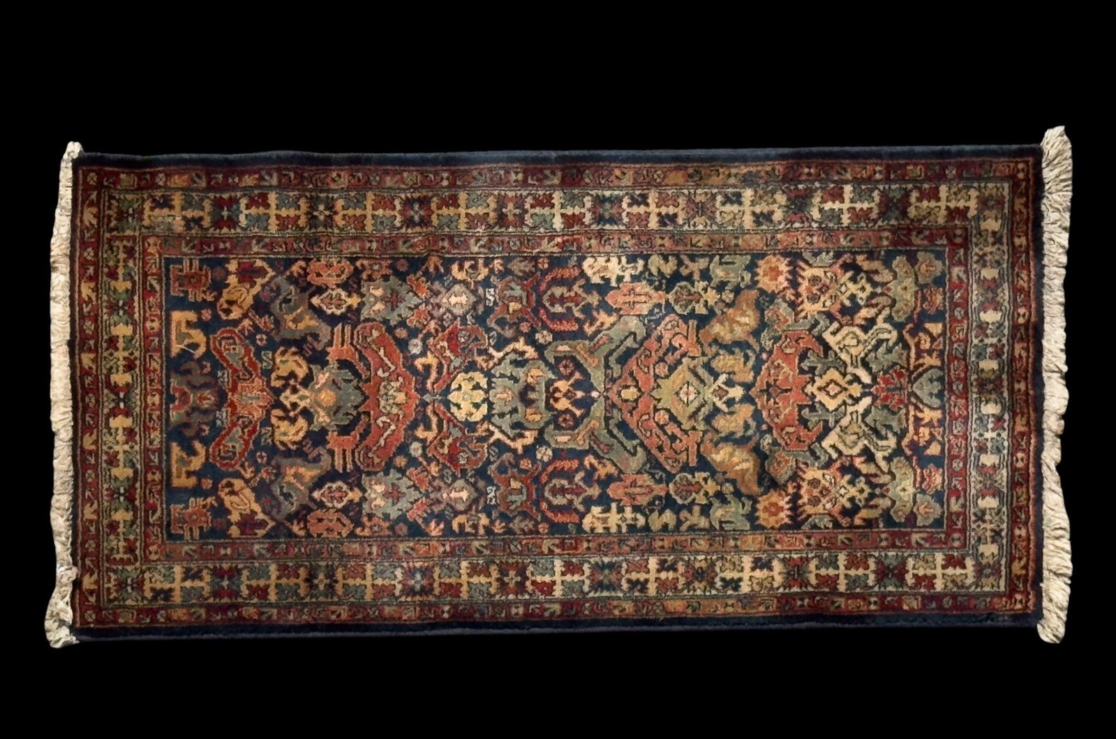 Persian Wool Rug: Persian area rug with geometric motifs against a dark ground. Measures approx. 2'5" x 4'4".