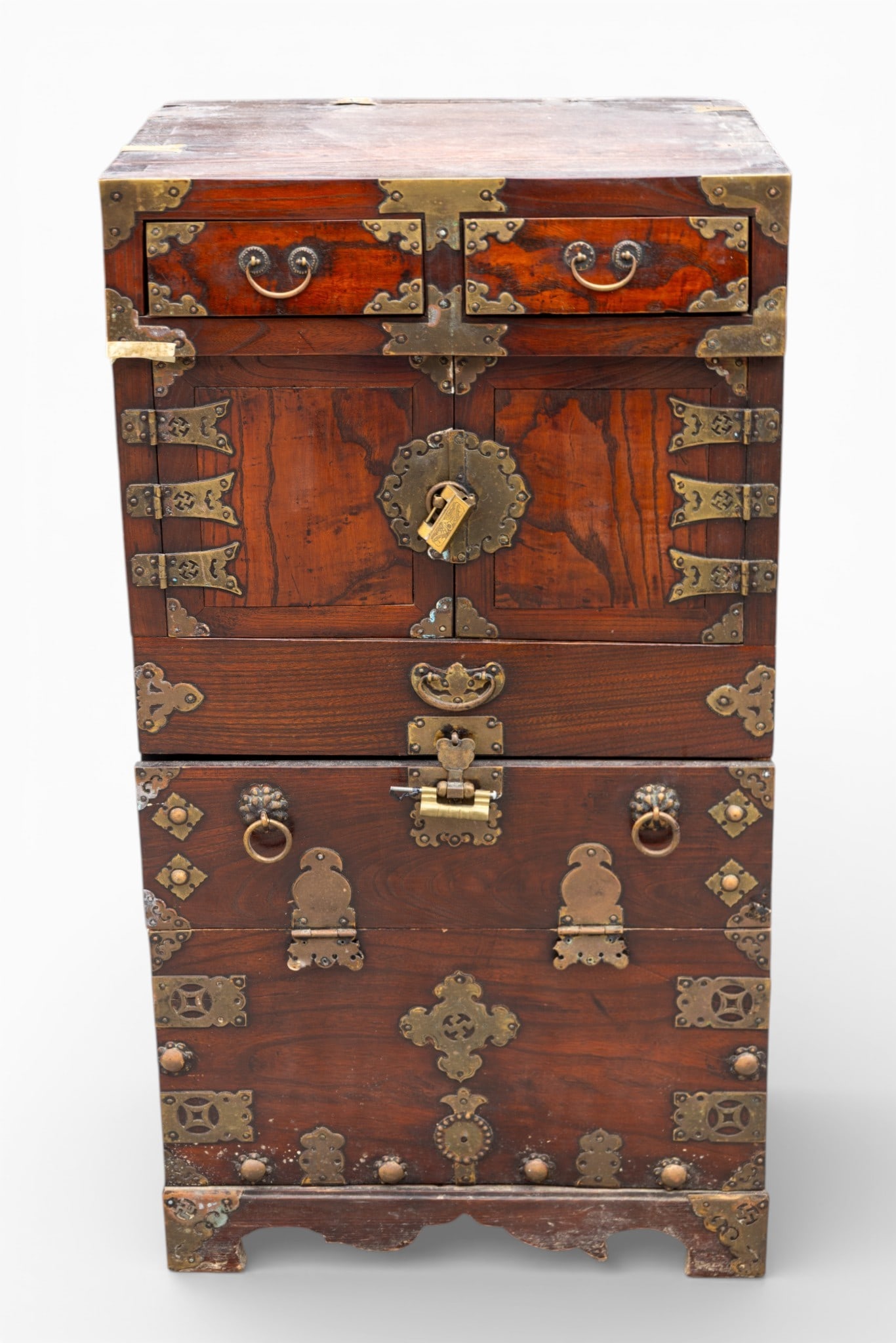 Antique Korean Jeon-Ju Chest / Wardrobe: Antique Jeon-Ju Korean chest / wardrobe, named after Jeongju city. It is constructed from wood, featuring decorative brass hardware and fittings. The chest includes two small upper drawers, a central 