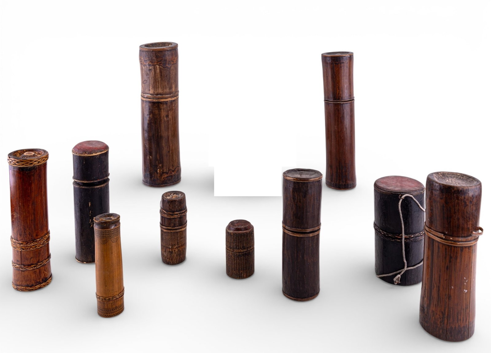 Early Korean Bamboo Brush Pots (10): A collection of (10) early Asian bamboo brush pots / containers with lids. Varying sizes and designs, some painted. Smallest measures approx. 4" H x 2" diam. and the largest measures approx. 12.75" H