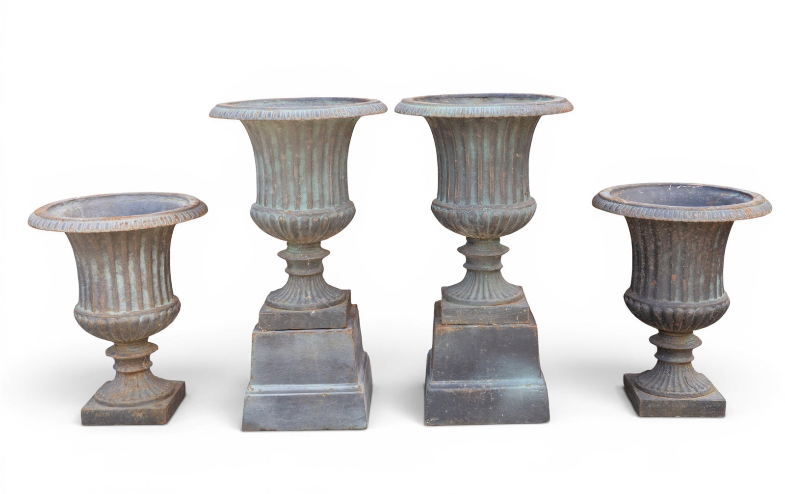 4 Cast Iron Handled Urns w/ Floral Relief: 4 cast iron urns, 2 of which have matching square bases, each urn featuring twin handles, fluted rims, and relief floral decoration. Approx assembled height 26.5"; urns without bases approx. 19" Tall 