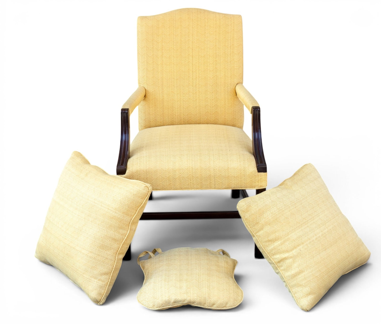 Mahogany Upholstered Armchair: Mahogany arm chair featuring a fine textured butter yellow upholstery with matching cushions. Measures approx. 25" W x 24" D x 39" H. Pick up must be completed within two weeks from auction, or storag