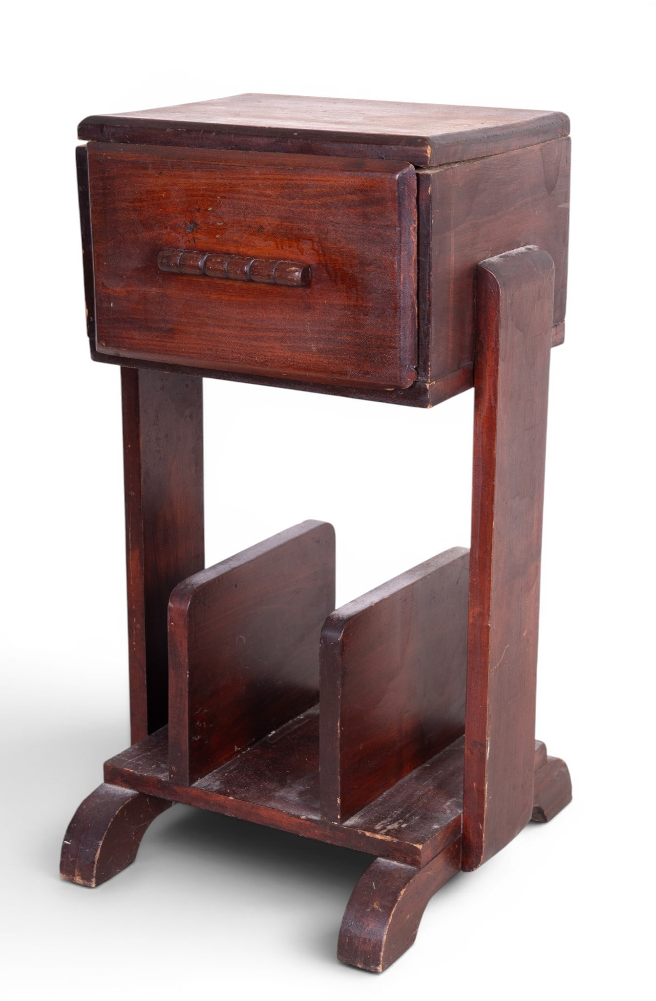 Art Deco Side Table and Magazine Rack: An Art Deco solid wood bedside table with drawer storage and built in magazine rack. Note minor scuffs due to age and use. Measures approx. 14" W x 14" D x 25" H.