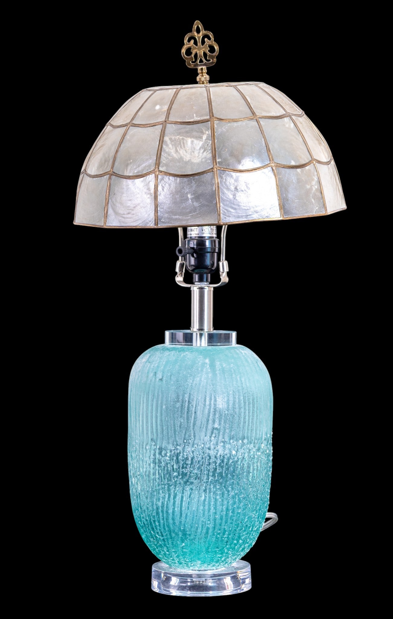 Art Glass & Lucite Lamp w/ Mother of Pearl Shade: A contemporary art glass table lamp with lucite accents, and brass finial. Measures approx. 17" to the socket, 22" to the finial. It includes a mother of pearl translucent panel and brass frame lamp s