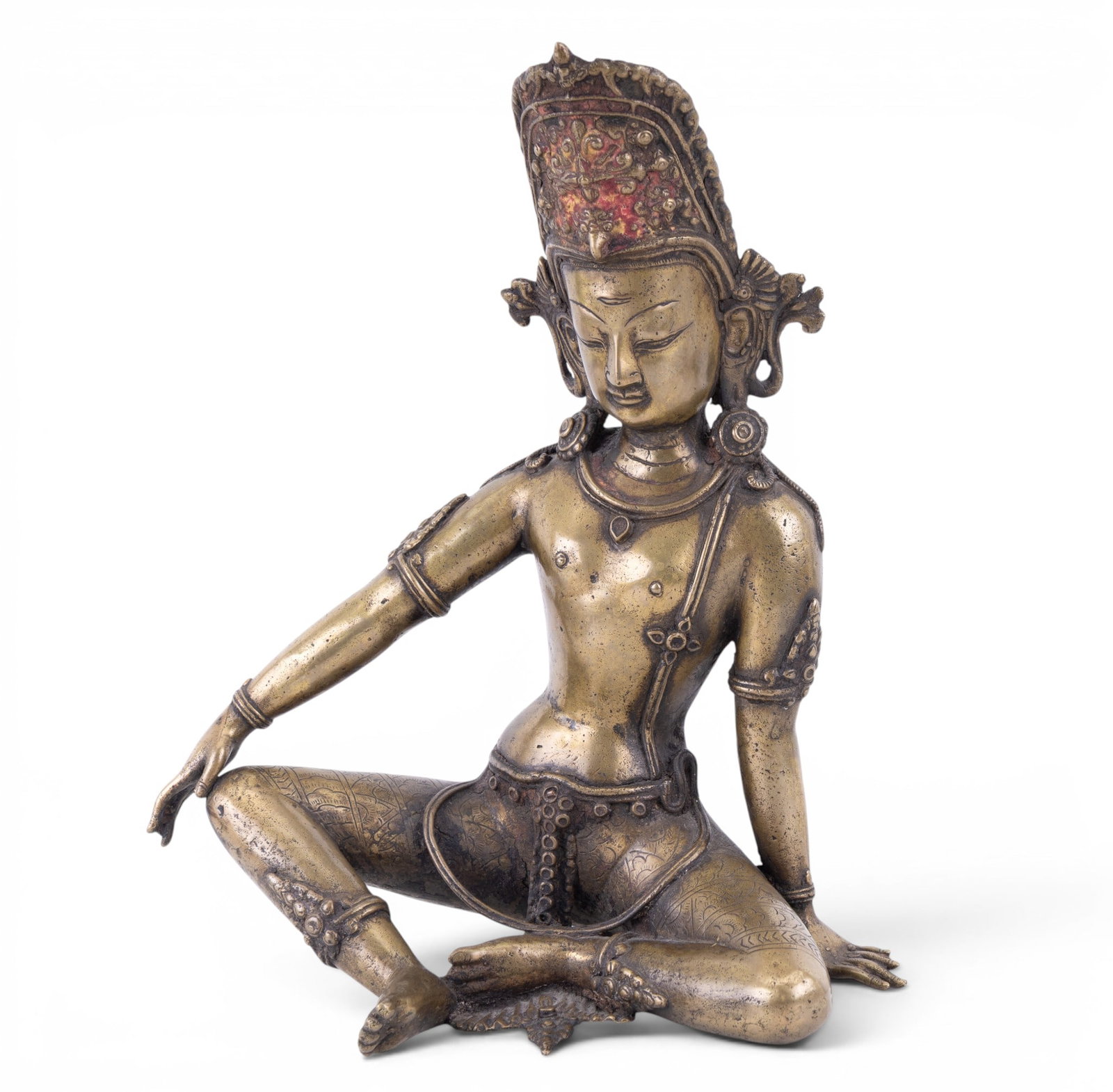 Himalayan Bronze Bodhisattva Figure: Cast bronze figure depicting a seated Bodhisattva in the Himalayan tradition (likely Nepalese or Tibetan), shown in a relaxed pose. Figure wears an elaborate crown, ear ornaments, and applied jewelry.