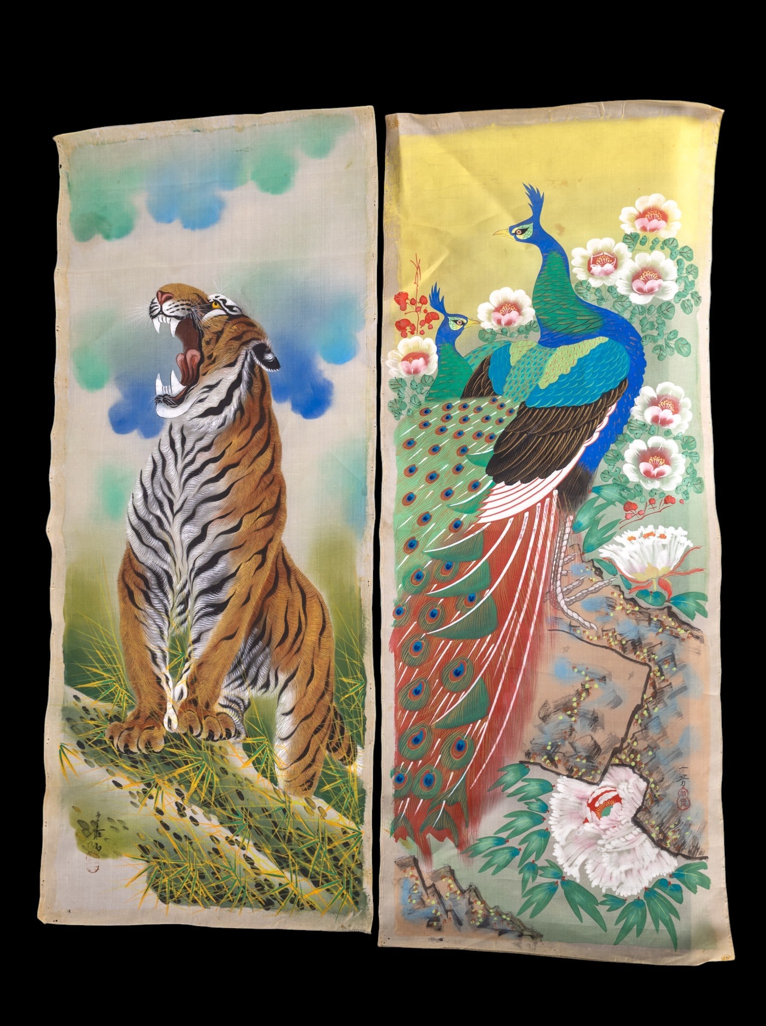 Pair of Asian Hand-Painted Silk Panels ~3.5" H: Hand-painted silk panels (2), one depicting a vibrant peacock among flowering branches, and the other depicting a tiger roaring in dynamic pose. Each example features an artist signature and red seal 