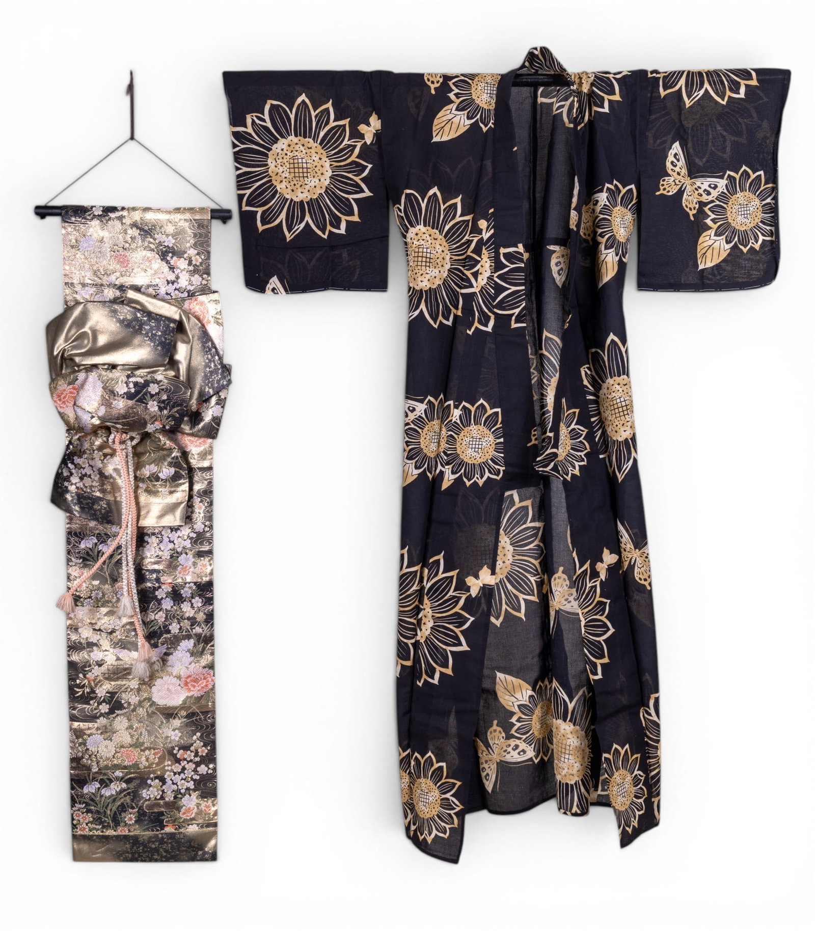 Japanese Cotton Twill Kimono and Obi: A Japanese vintage cotton twill kimono measuring approx. 64" hem to collar x 48" cuff to cuff. Also included is an embroidered obi converted to a wall hanging measuring approx. 54" long.
