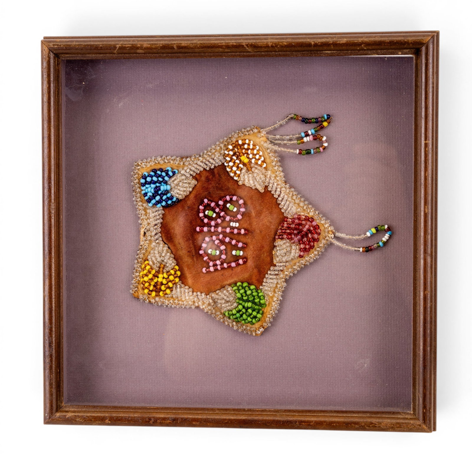 Hand Beaded Antique Iroquois Whimsy c. 1918: A float mounted and shadowbox framed antique hand beaded Iroquois Whimsy dated 1918. Frame measures approx. 11.25" H x 11.25" W.