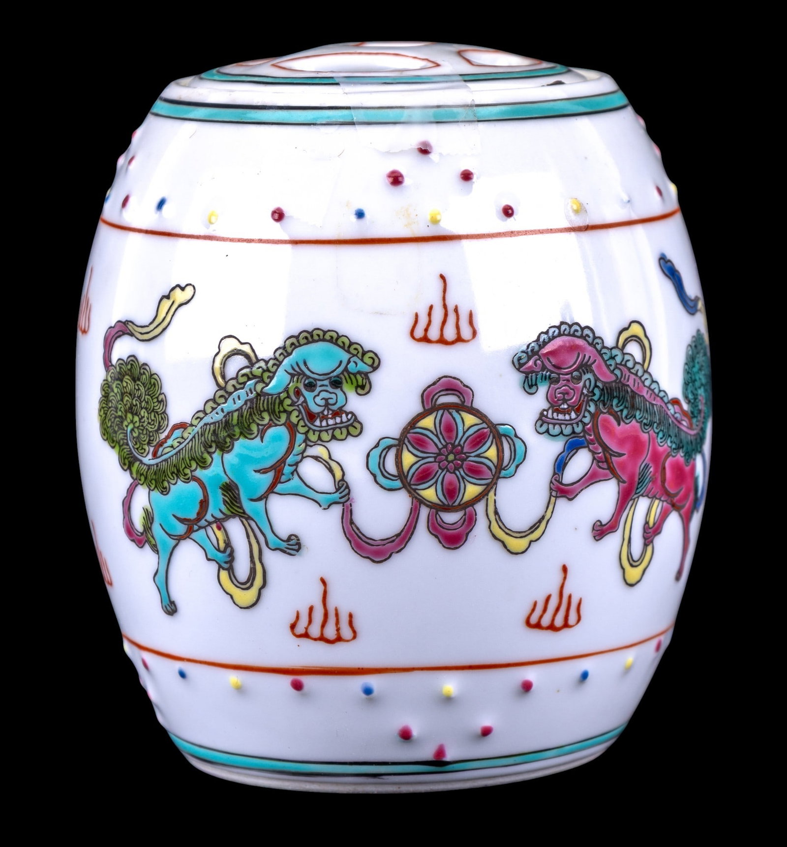 Vintage Chinese Porcelain Foo Dog Tea Jar: A vintage Chinese porcelain tea jar featuring colorful Foo dog designs around the perimeter. Marked 'Made in China'. Measures approx. 4.5" H.